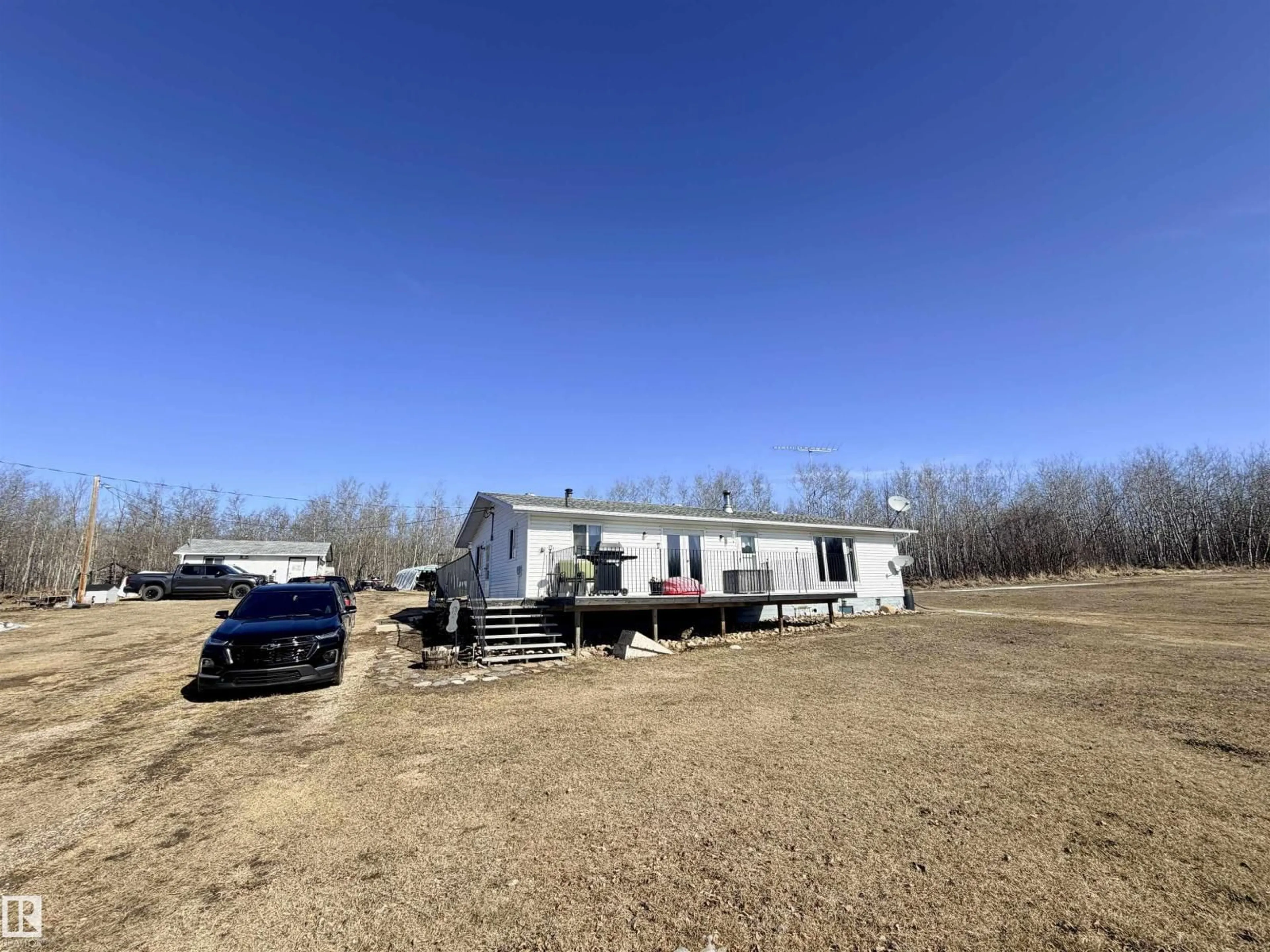 A pic from outside/outdoor area/front of a property/back of a property/a pic from drone, building for 11002 TWP RD 562, Rural St. Paul County Alberta T0A2G0