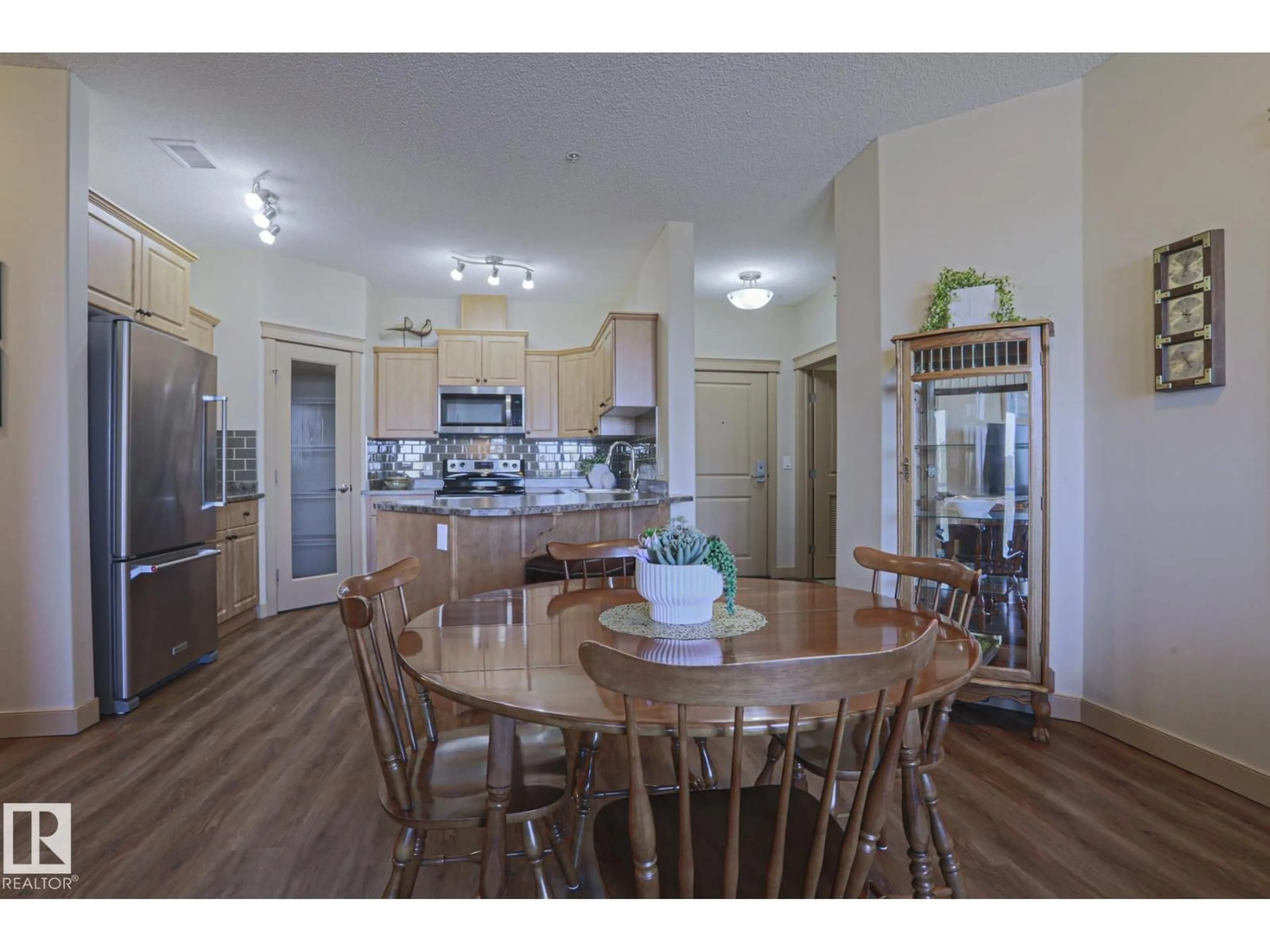 Open concept kitchen, wood/laminate floor for #207 - 4075 CLOVER BAR RD, Sherwood Park Alberta T8H0R6