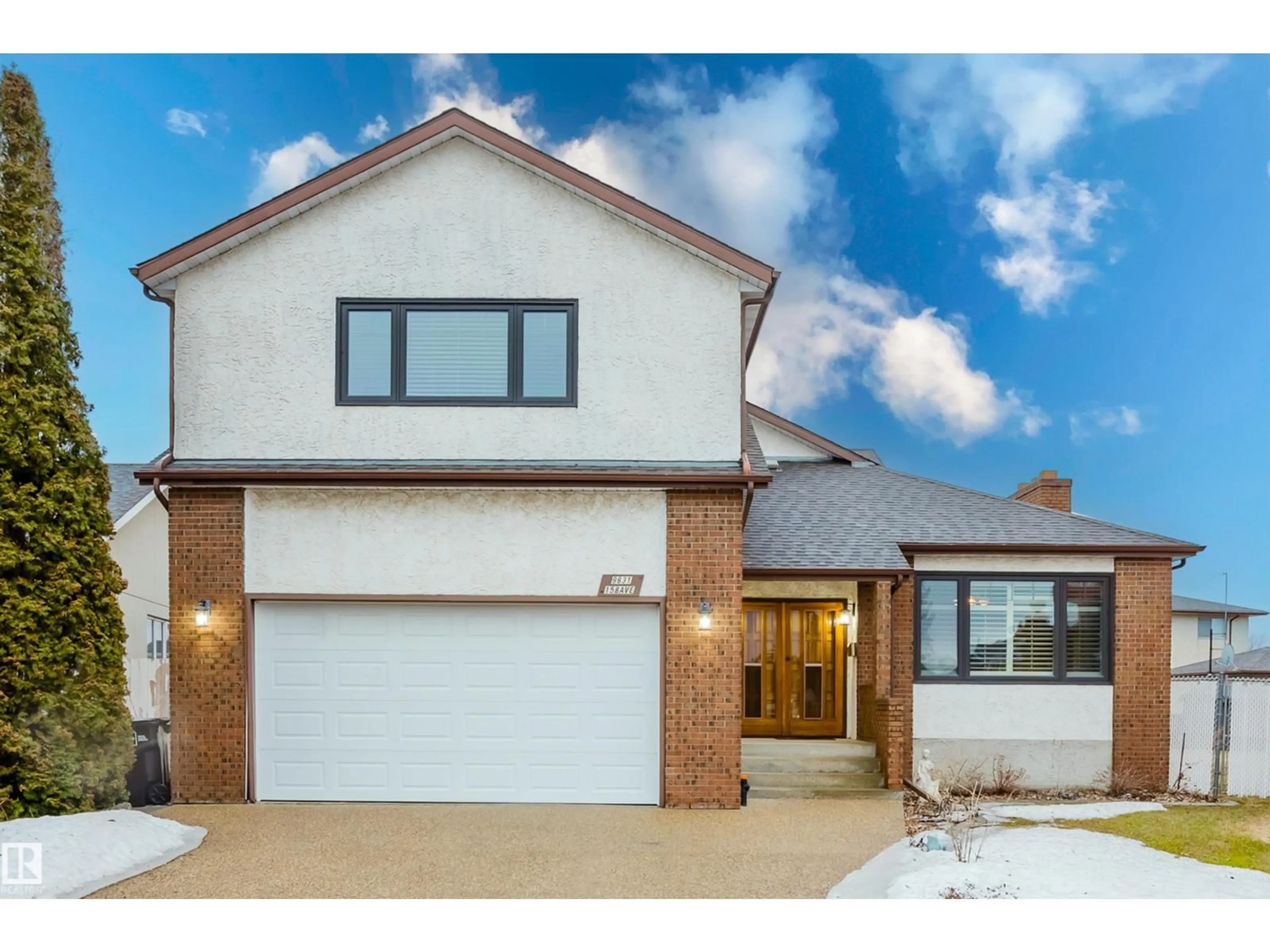 Home with brick exterior material, street for 9831 158 AV, Edmonton Alberta T5X4V3