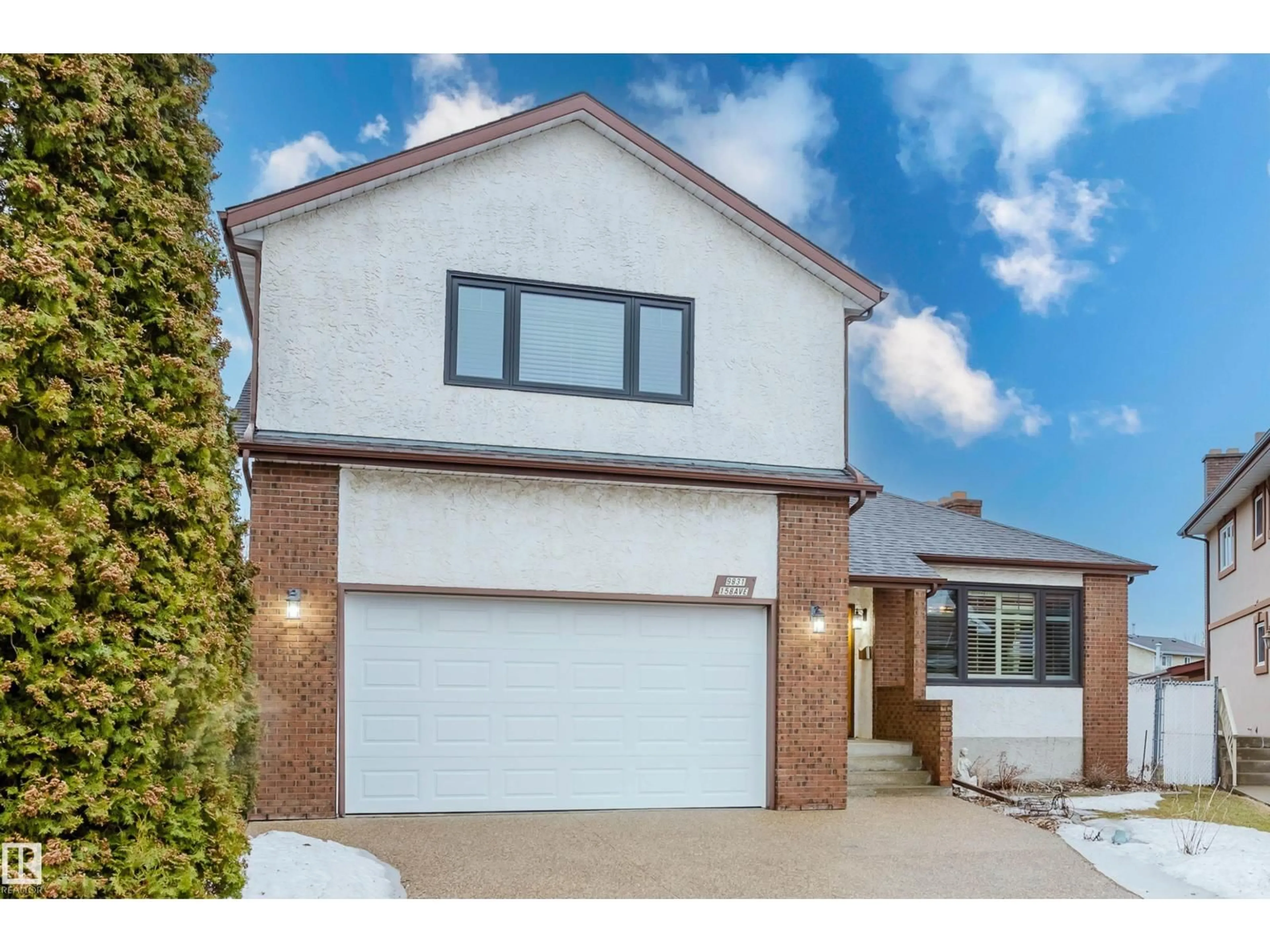 Home with brick exterior material, street for 9831 158 AV, Edmonton Alberta T5X4V3
