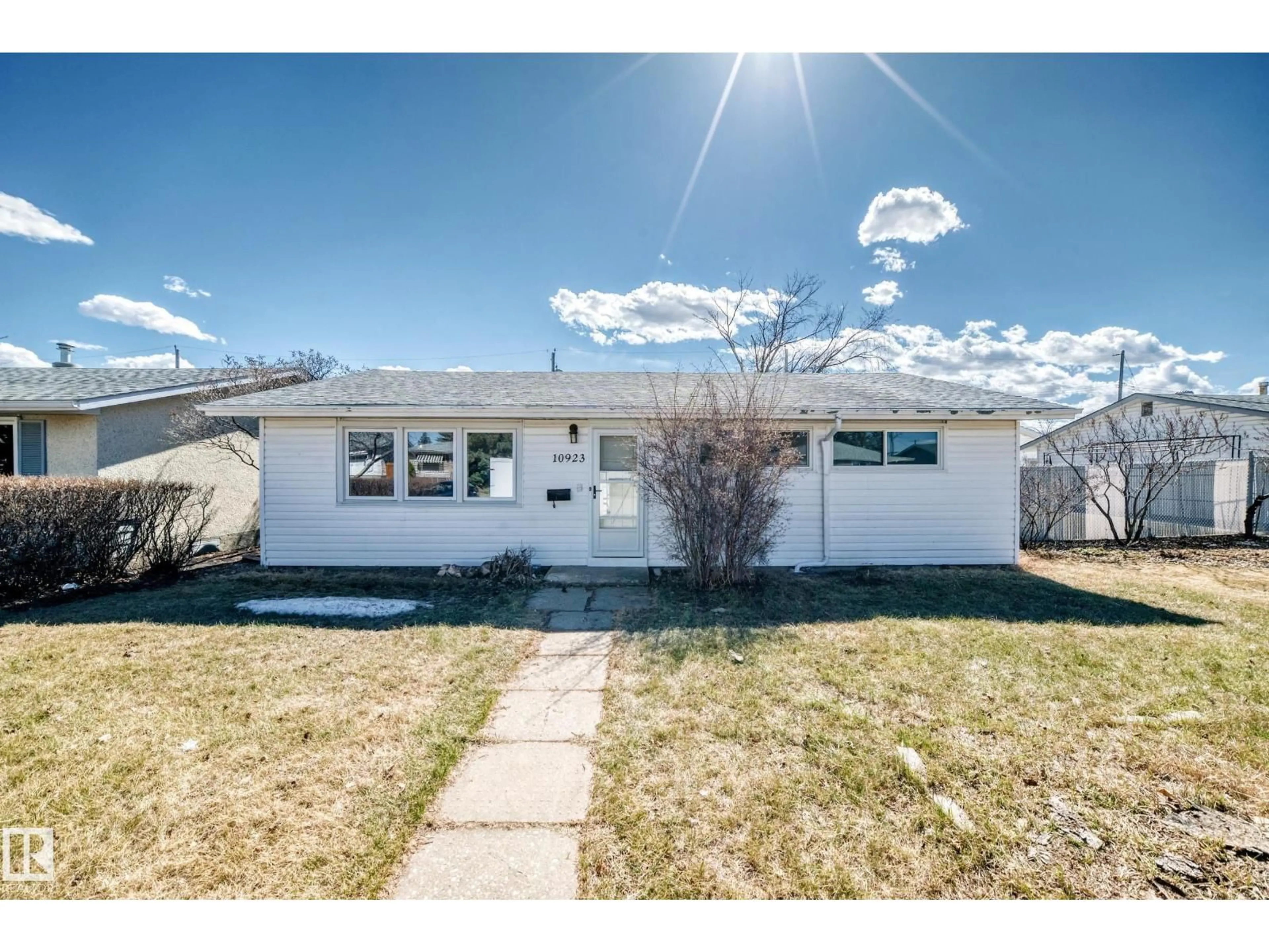 Home with vinyl exterior material, street for 10923 136 AV, Edmonton Alberta T5E1W6