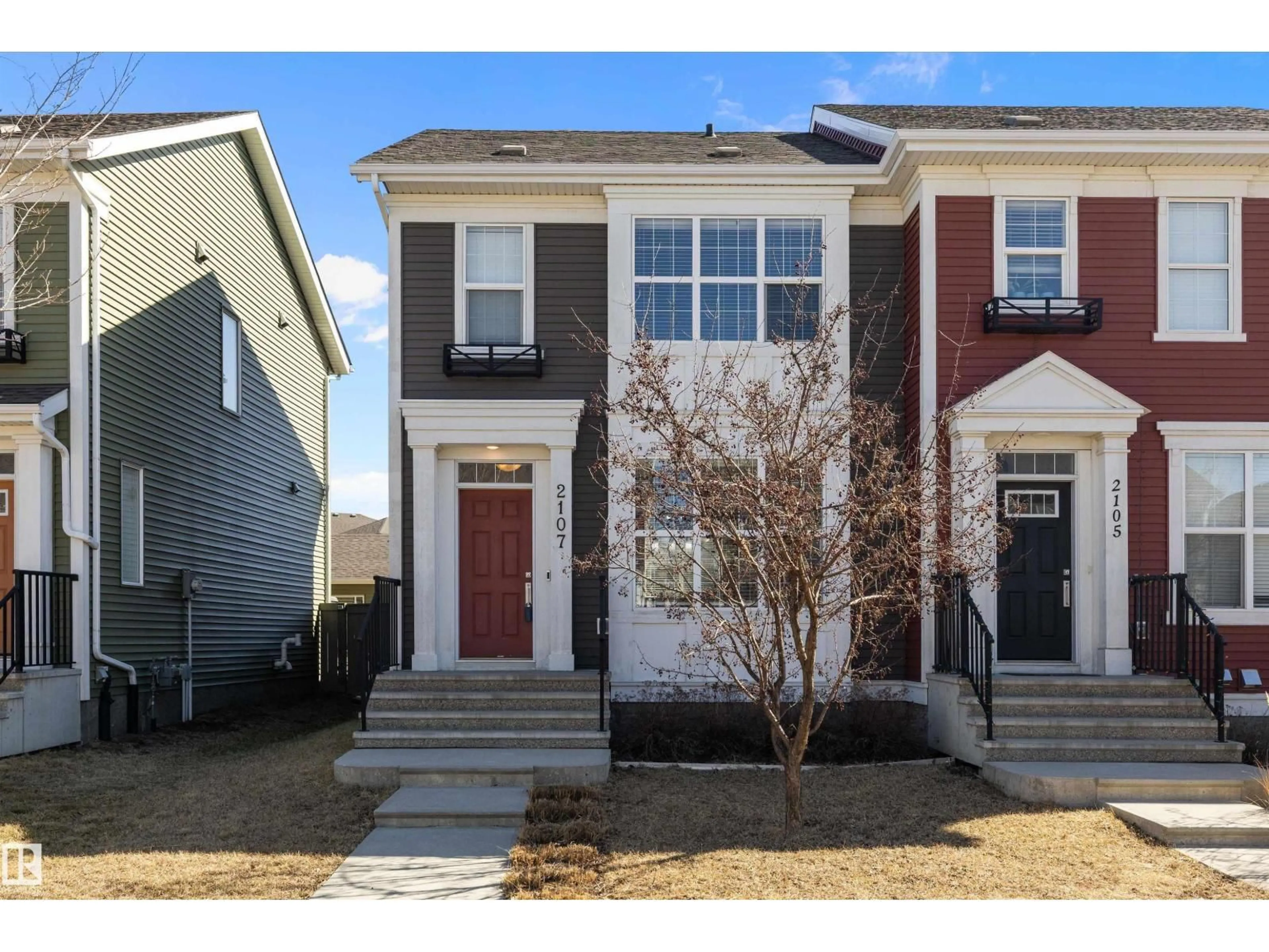 Home with vinyl exterior material, street for 2107 24 ST, Edmonton Alberta T6T0Y8