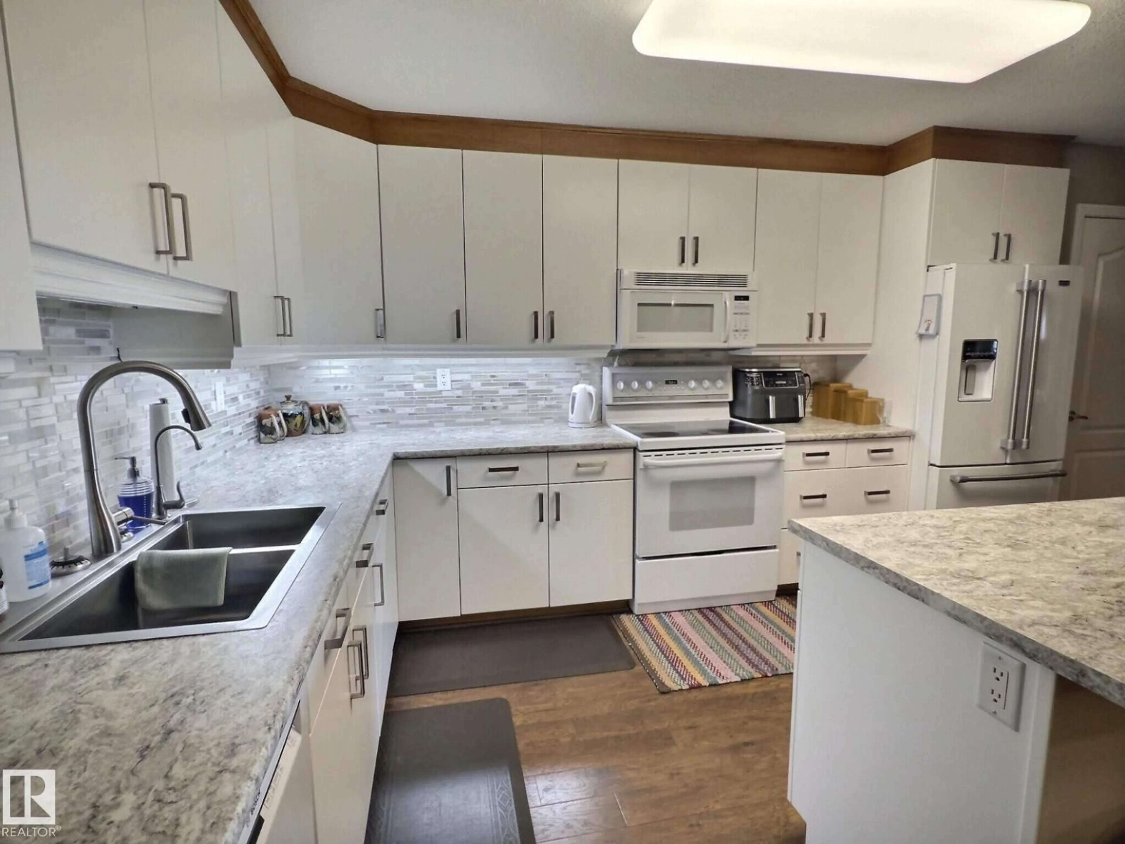 Open concept kitchen, ceramic/tile floor for #108 - 8922 156 ST, Edmonton Alberta T5R5Z3