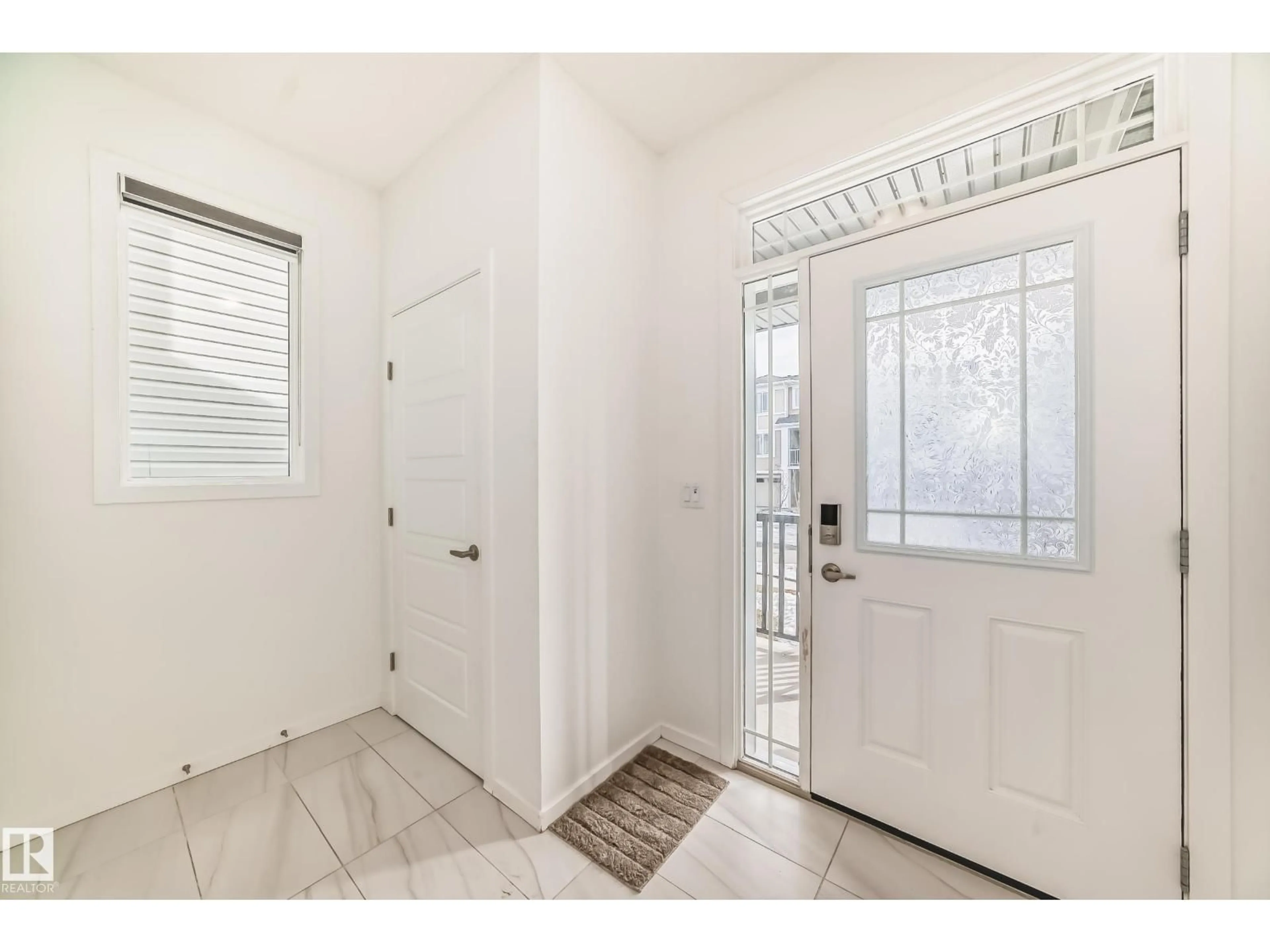 Indoor entryway for 20612 22 AV, Edmonton Alberta T6M1N3
