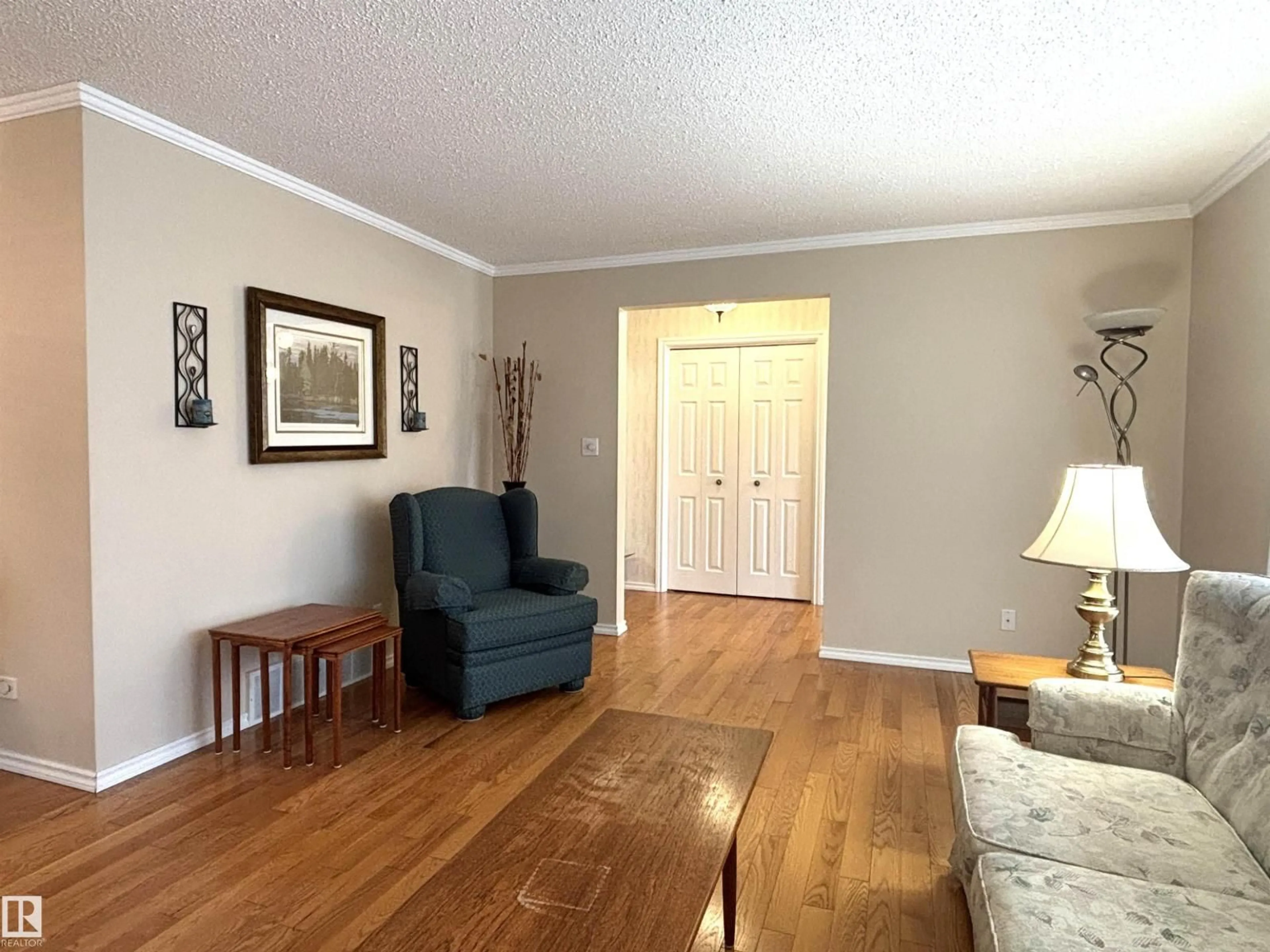 Living room with furniture, wood/laminate floor for 11139 30 AV, Edmonton Alberta T6J3Y7