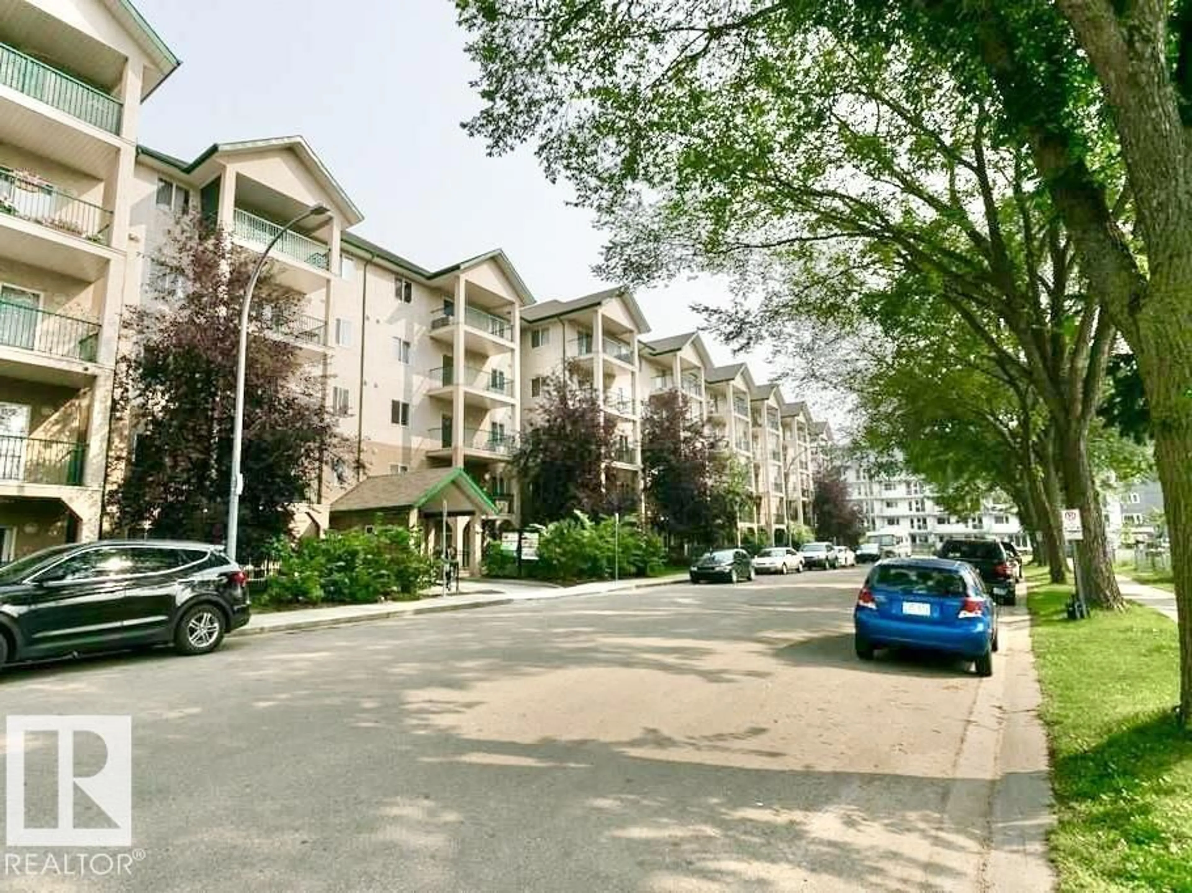 A pic from outside/outdoor area/front of a property/back of a property/a pic from drone, street for #413 - 11325 83 ST, Edmonton Alberta T5B4W5