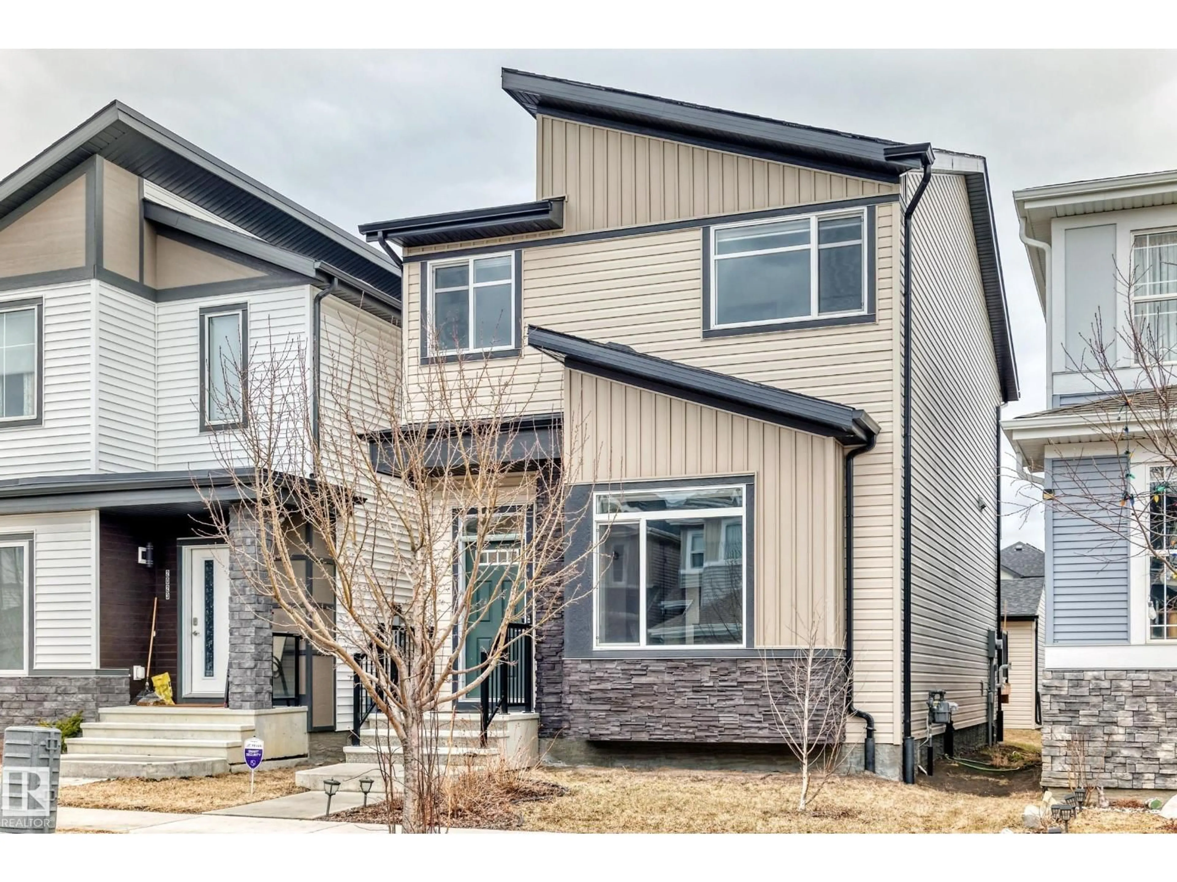 Home with vinyl exterior material, street for SW - 2027 160 ST, Edmonton Alberta T6W4E7