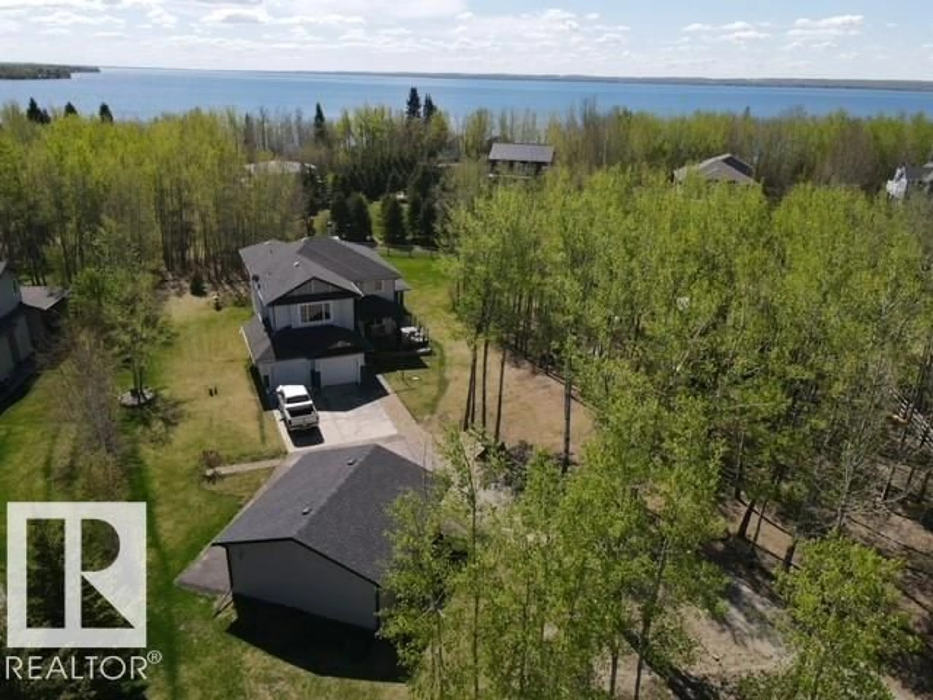 A pic from outside/outdoor area/front of a property/back of a property/a pic from drone, water/lake/river/ocean view for 90 47411 RGE RD 14, Rural Leduc County Alberta T0C2P0