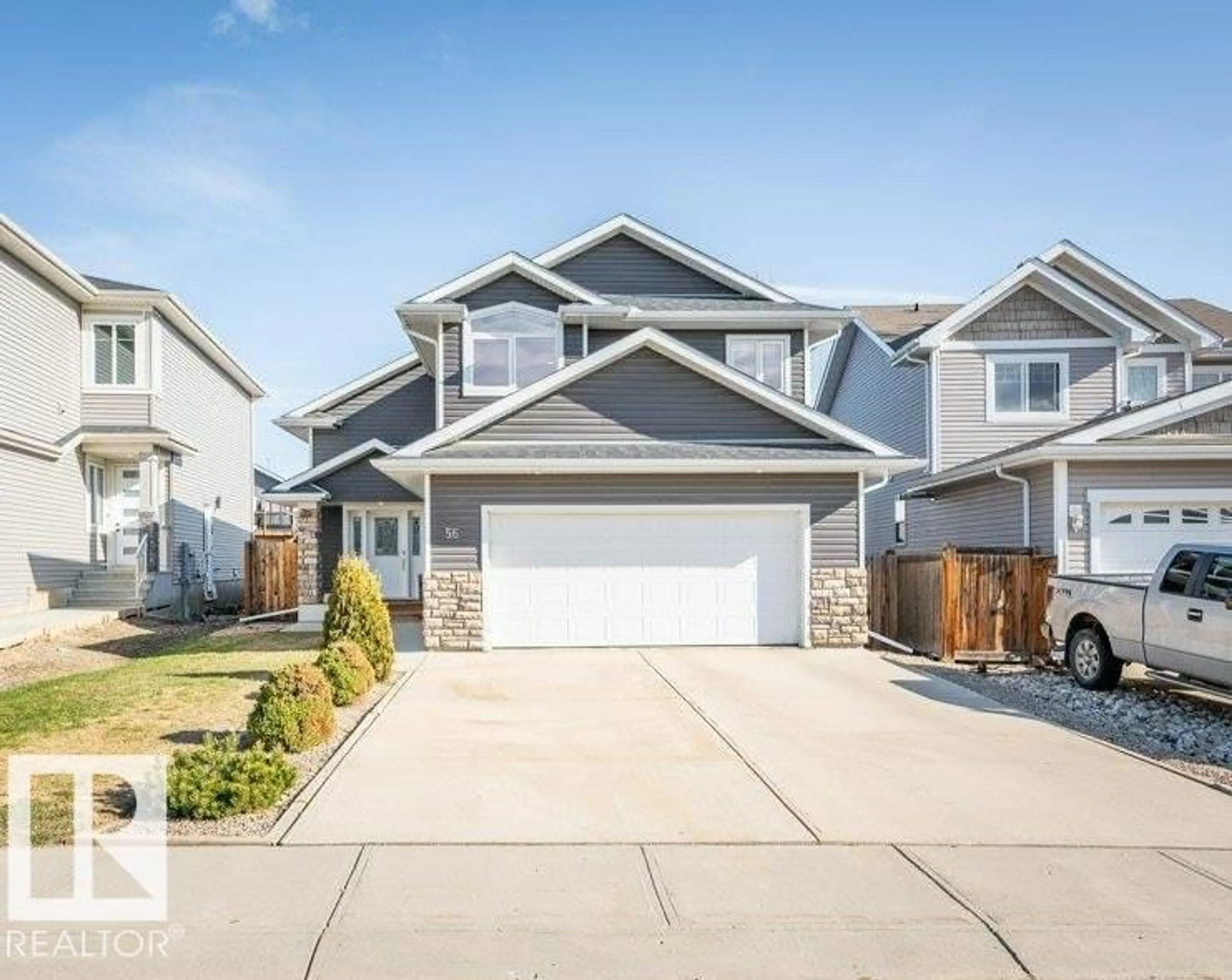 Home with vinyl exterior material, street for 56 LANDING TRAIL DR, Gibbons Alberta T0A1N0