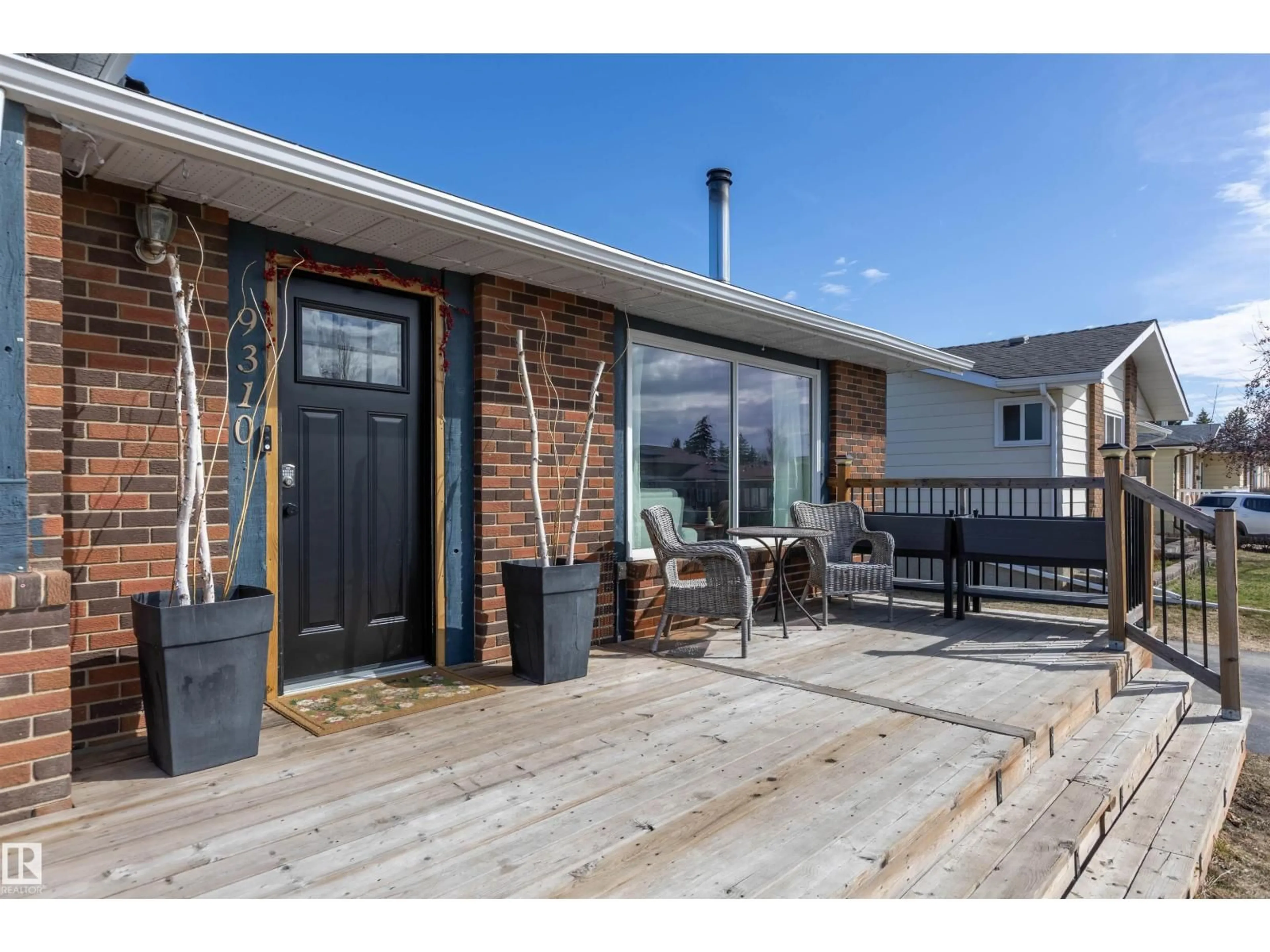 Home with brick exterior material, street for 9310 98 AV, Morinville Alberta T8R1J4