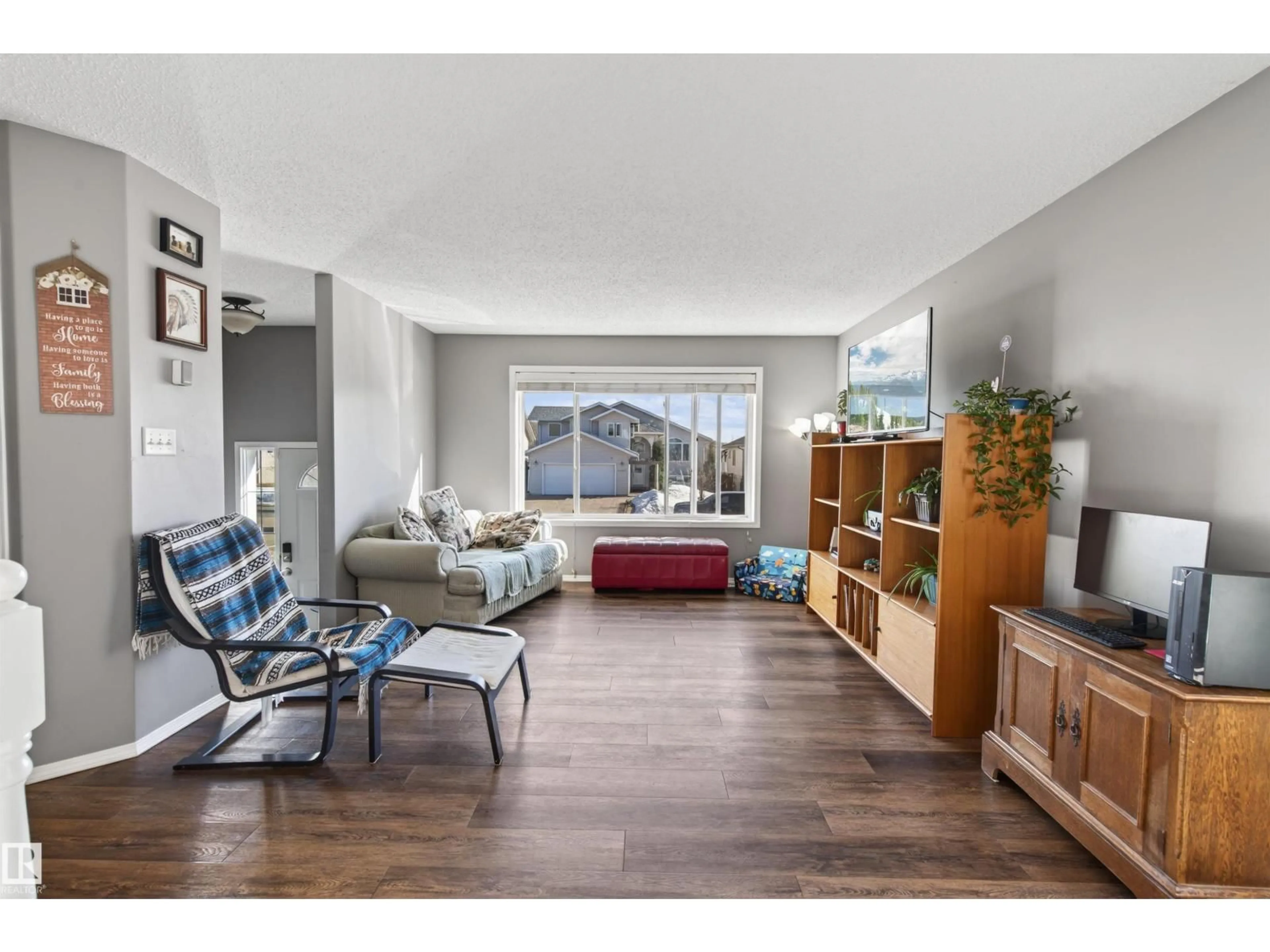 Living room with furniture, wood/laminate floor for 4410 47 AV, Cold Lake Alberta T9M2E2