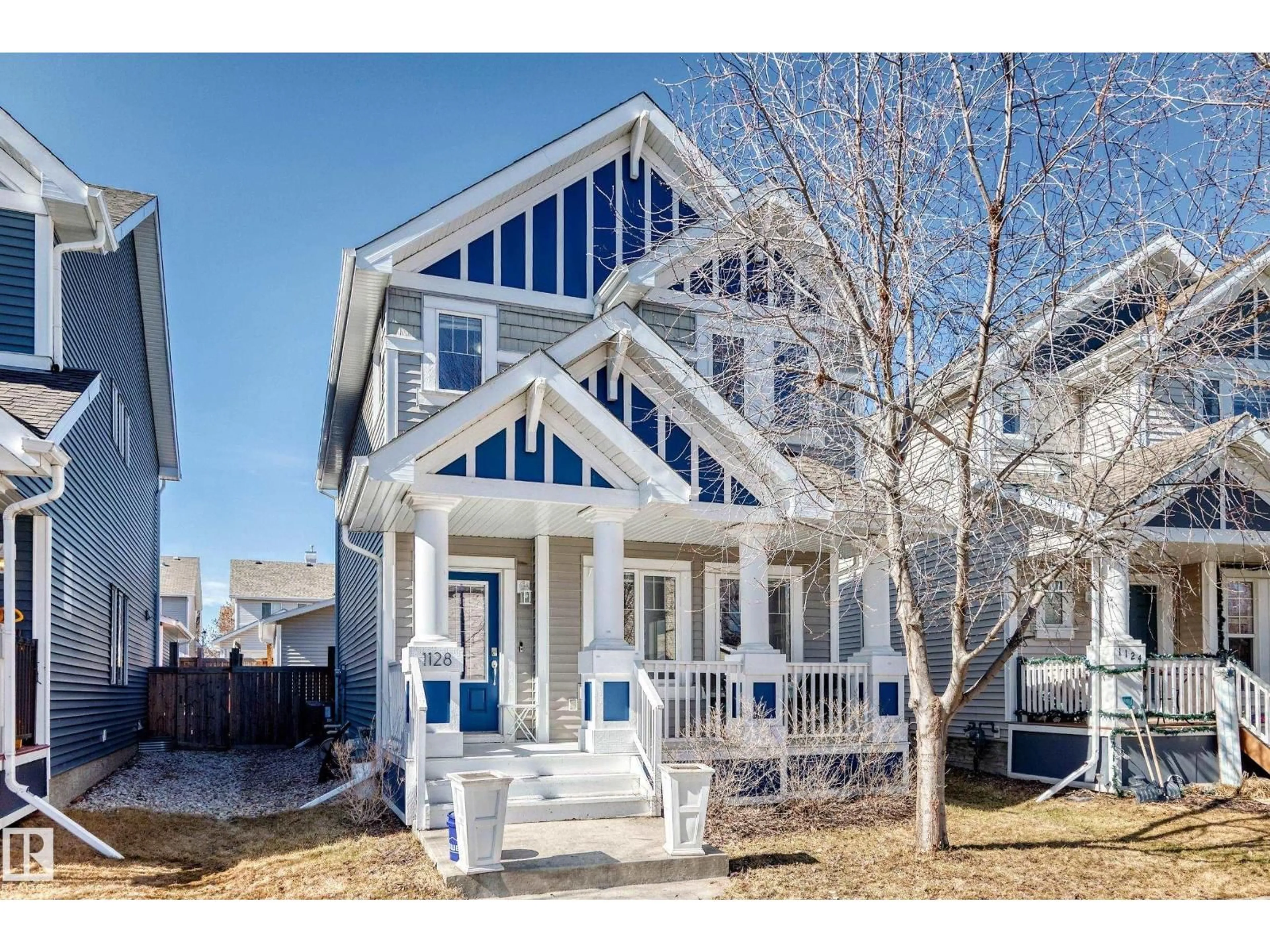 Home with vinyl exterior material, street for 1128 74 ST, Edmonton Alberta T6X0N7