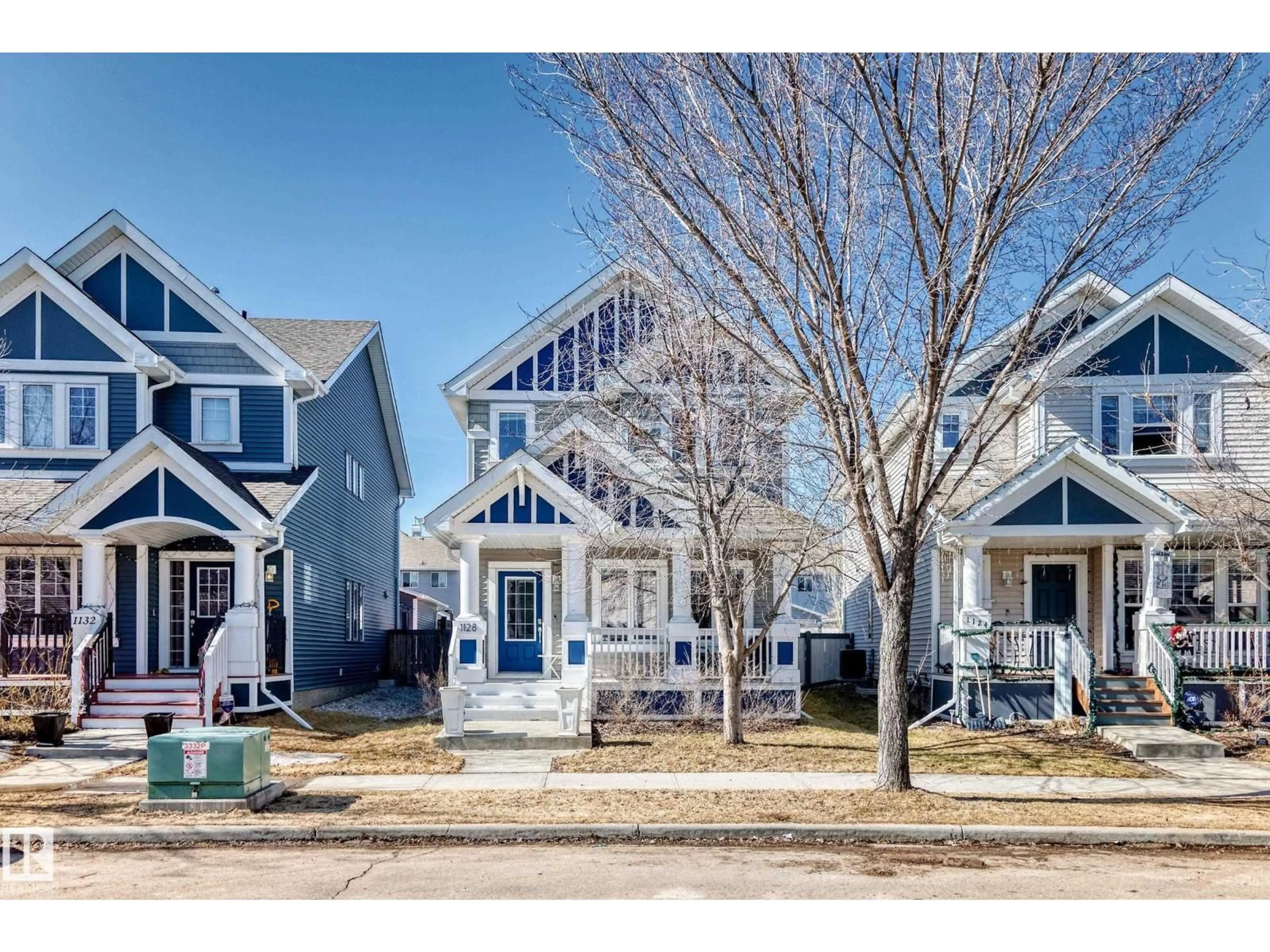 Home with vinyl exterior material, street for 1128 74 ST, Edmonton Alberta T6X0N7