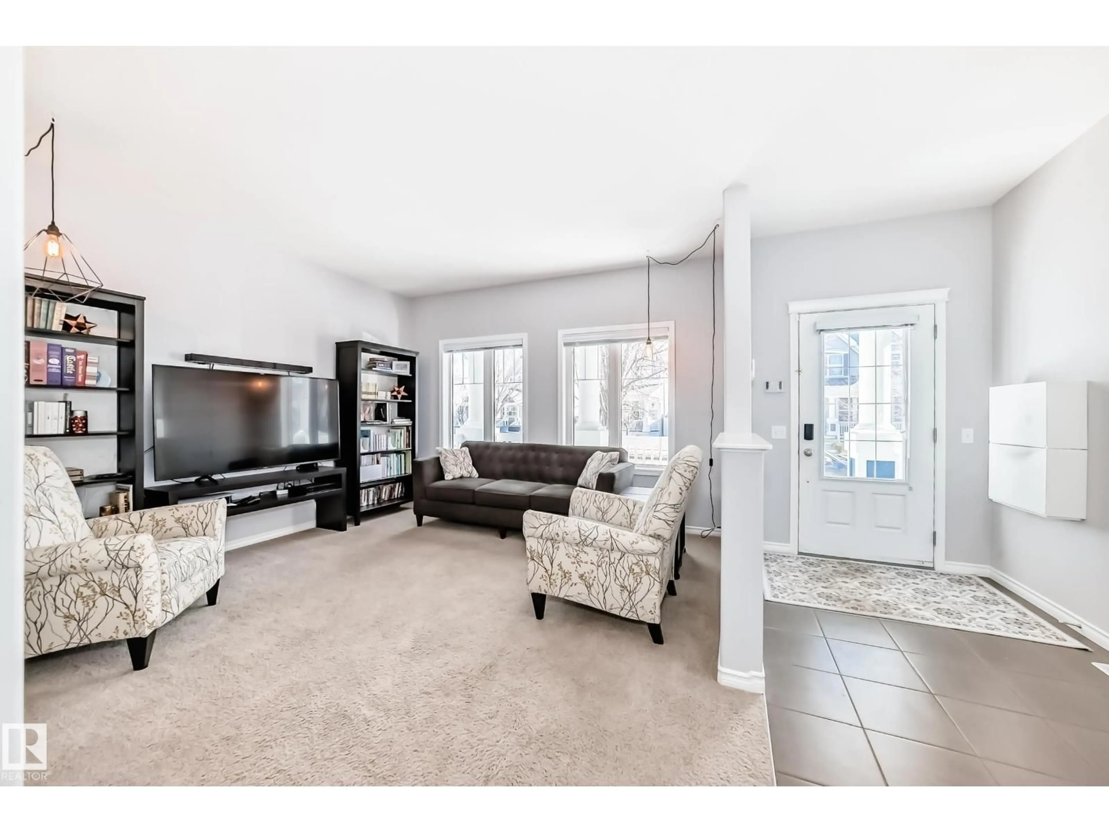 Living room with furniture, ceramic/tile floor for 1128 74 ST, Edmonton Alberta T6X0N7