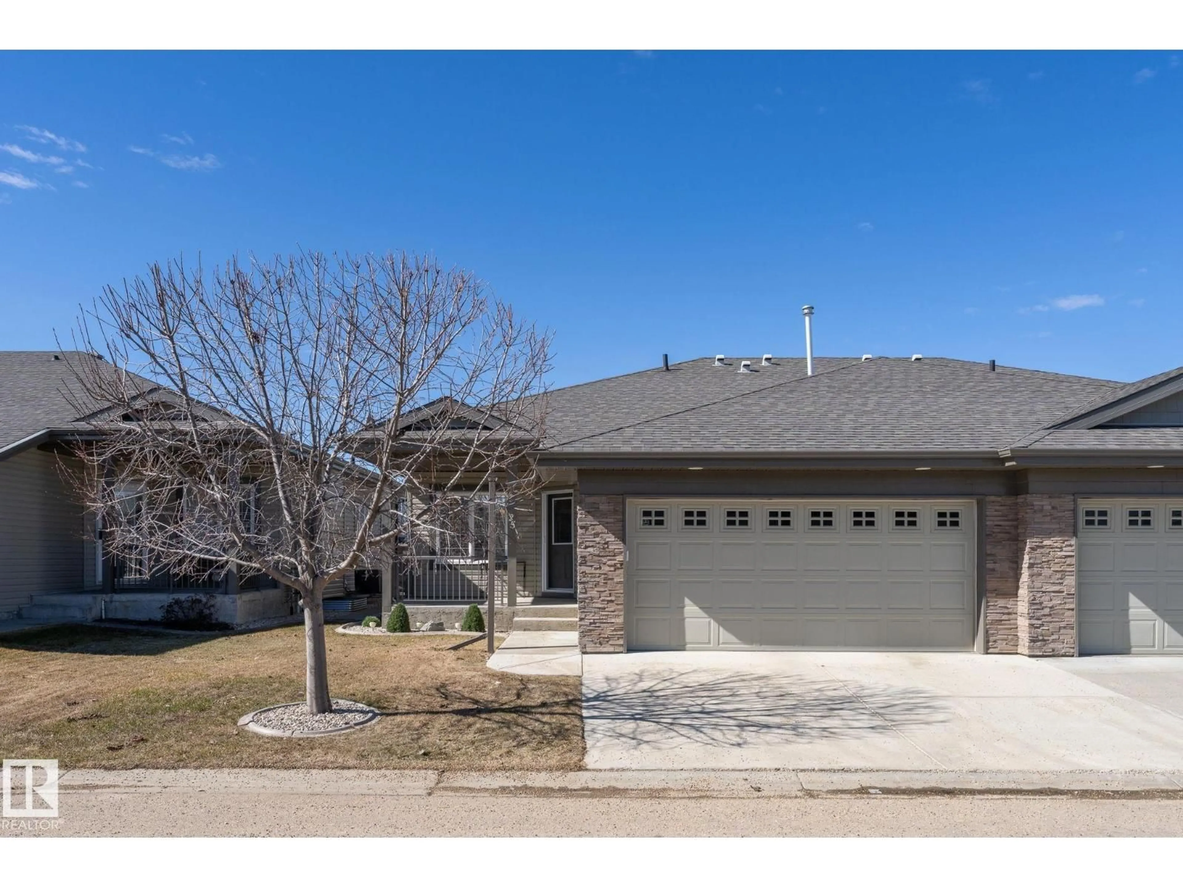 Home with brick exterior material, street for 25 - 340 SPRUCE RIDGE RD, Spruce Grove Alberta T7X0J4