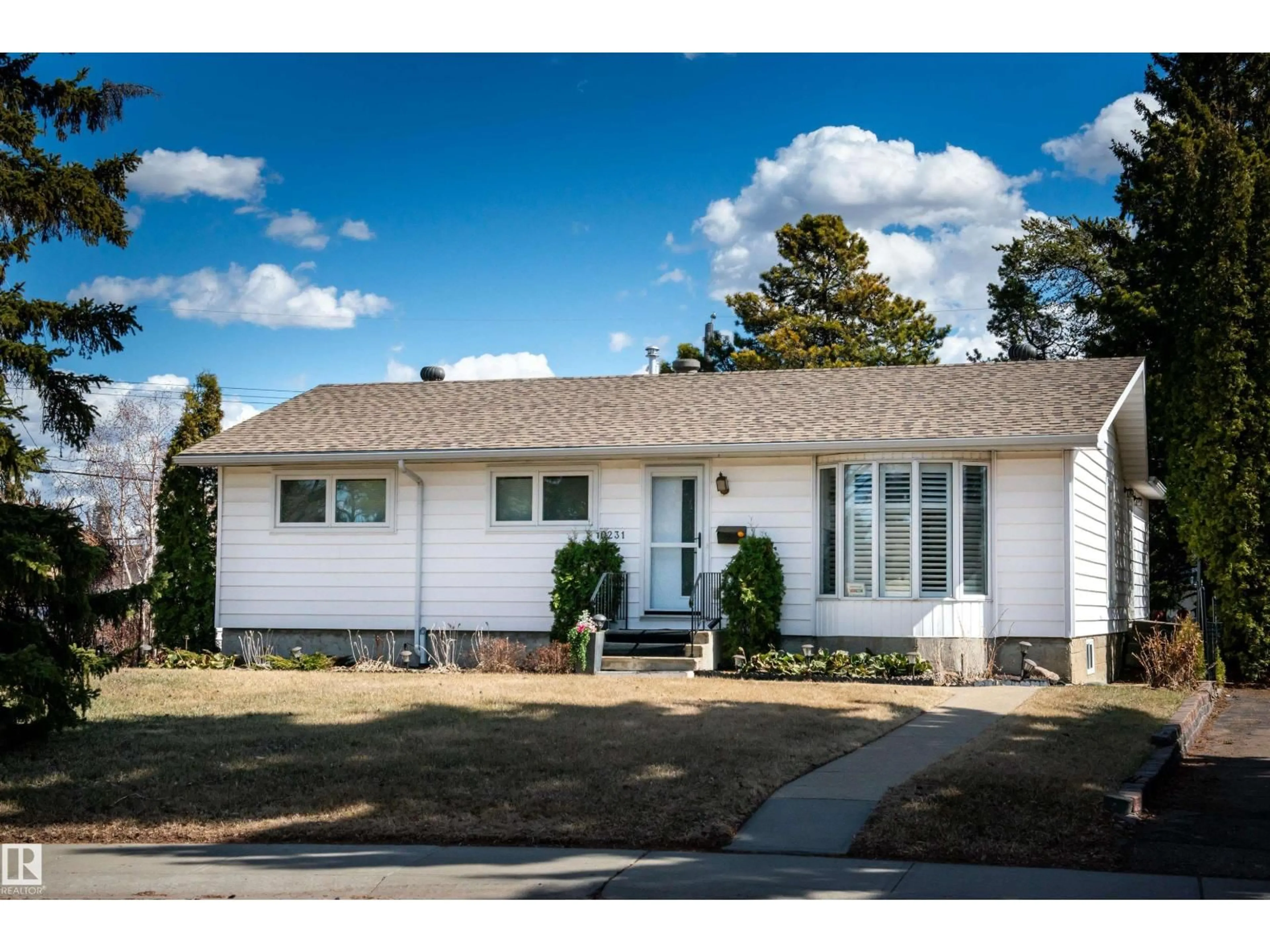Home with vinyl exterior material, street for 10231 46 ST, Edmonton Alberta T6A1X9