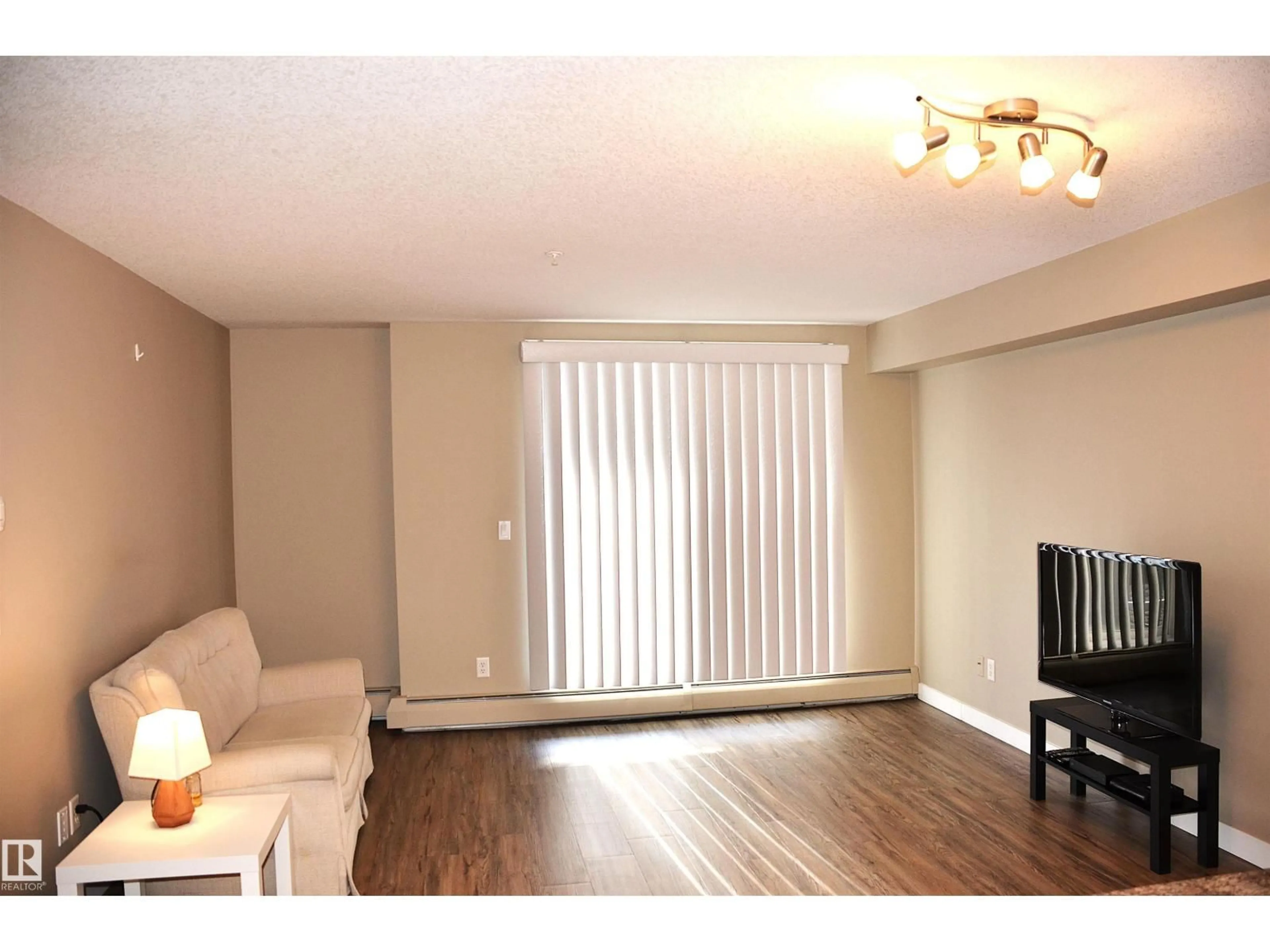 Living room with furniture, wood/laminate floor for #103 - 920 156 ST, Edmonton Alberta T6R0N6