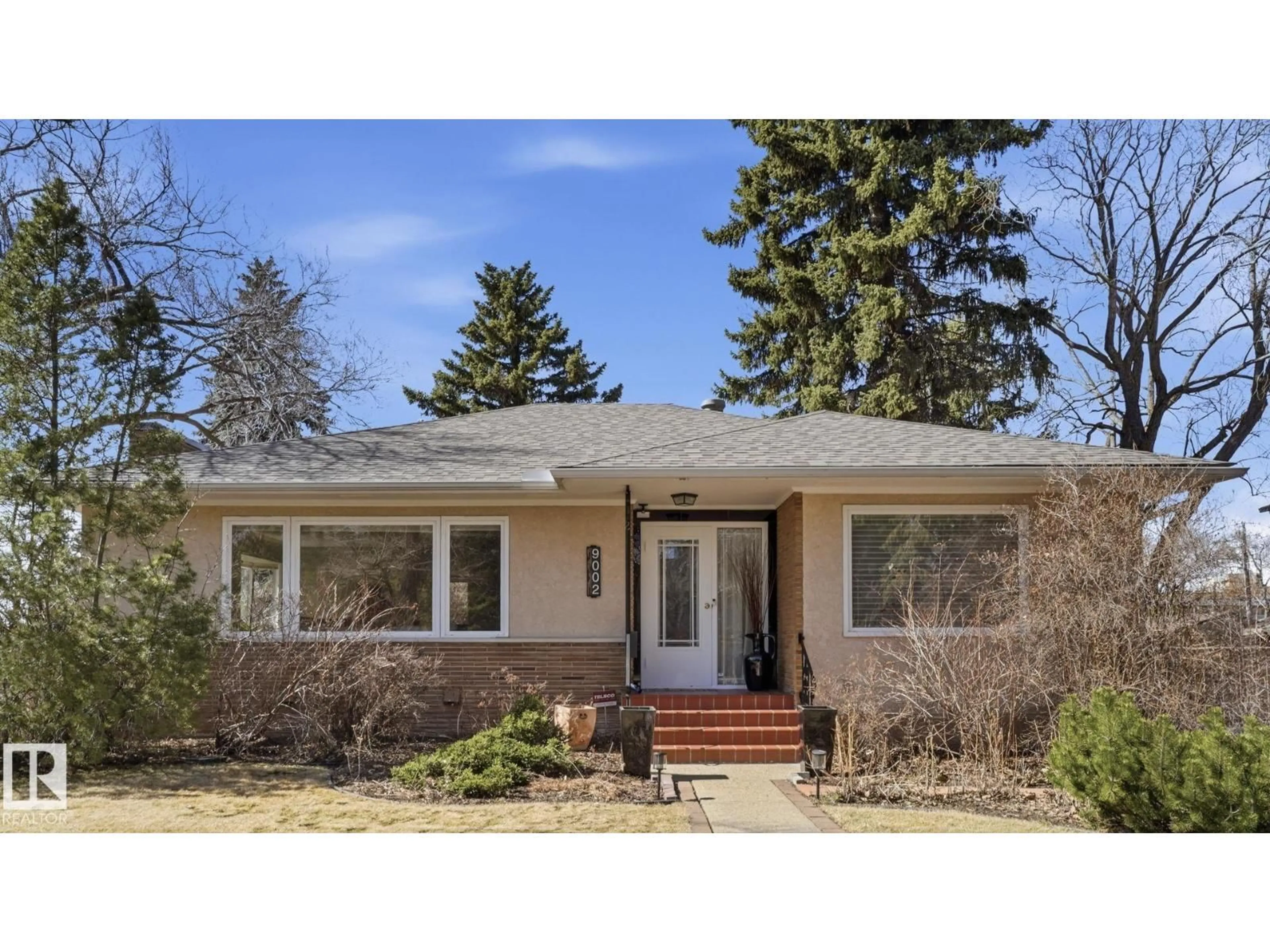 Home with vinyl exterior material, street for 9002 120 ST, Edmonton Alberta T6G1X7