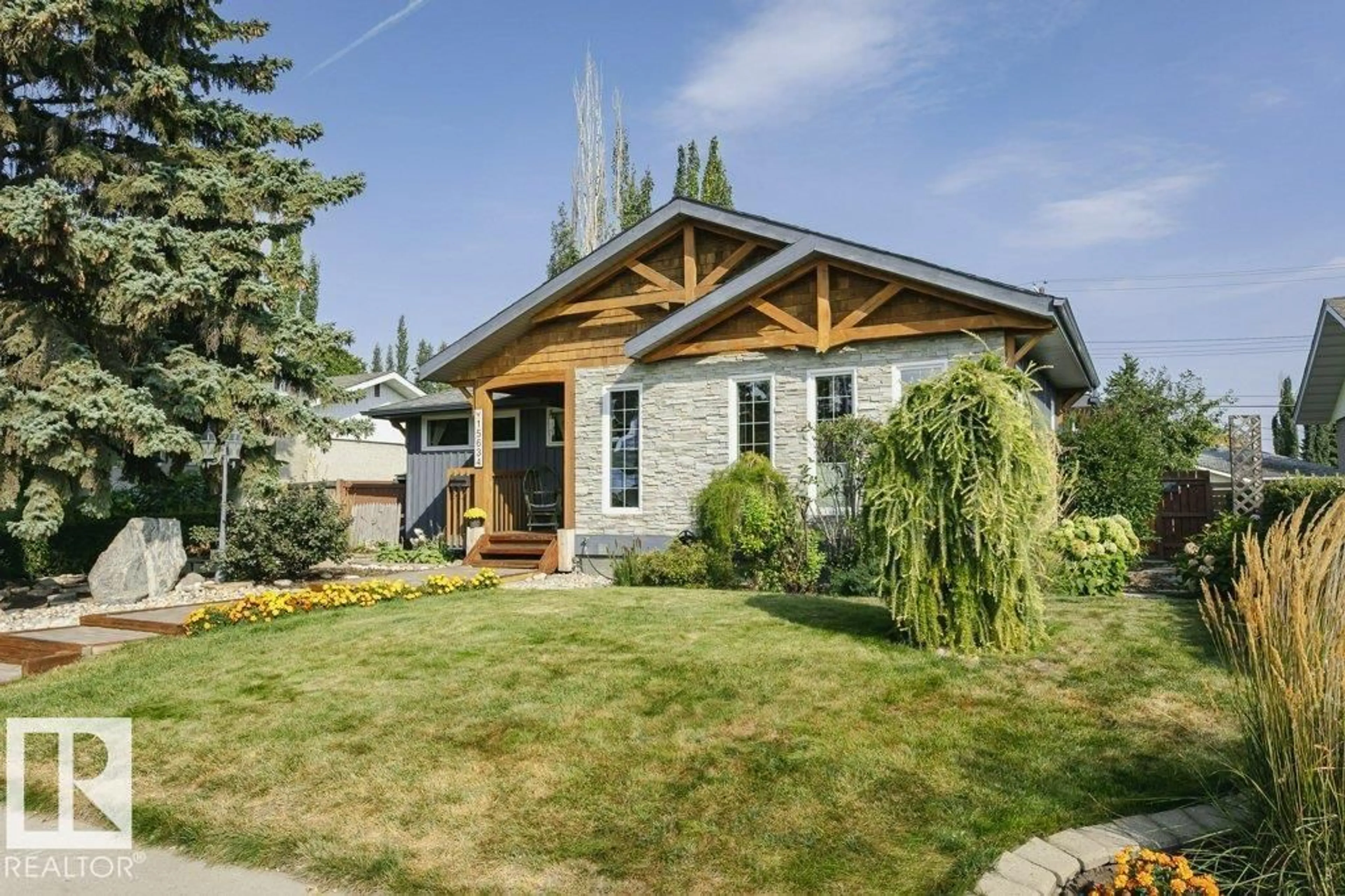 Home with vinyl exterior material, street for 15634 81 AV, Edmonton Alberta T5R3P4