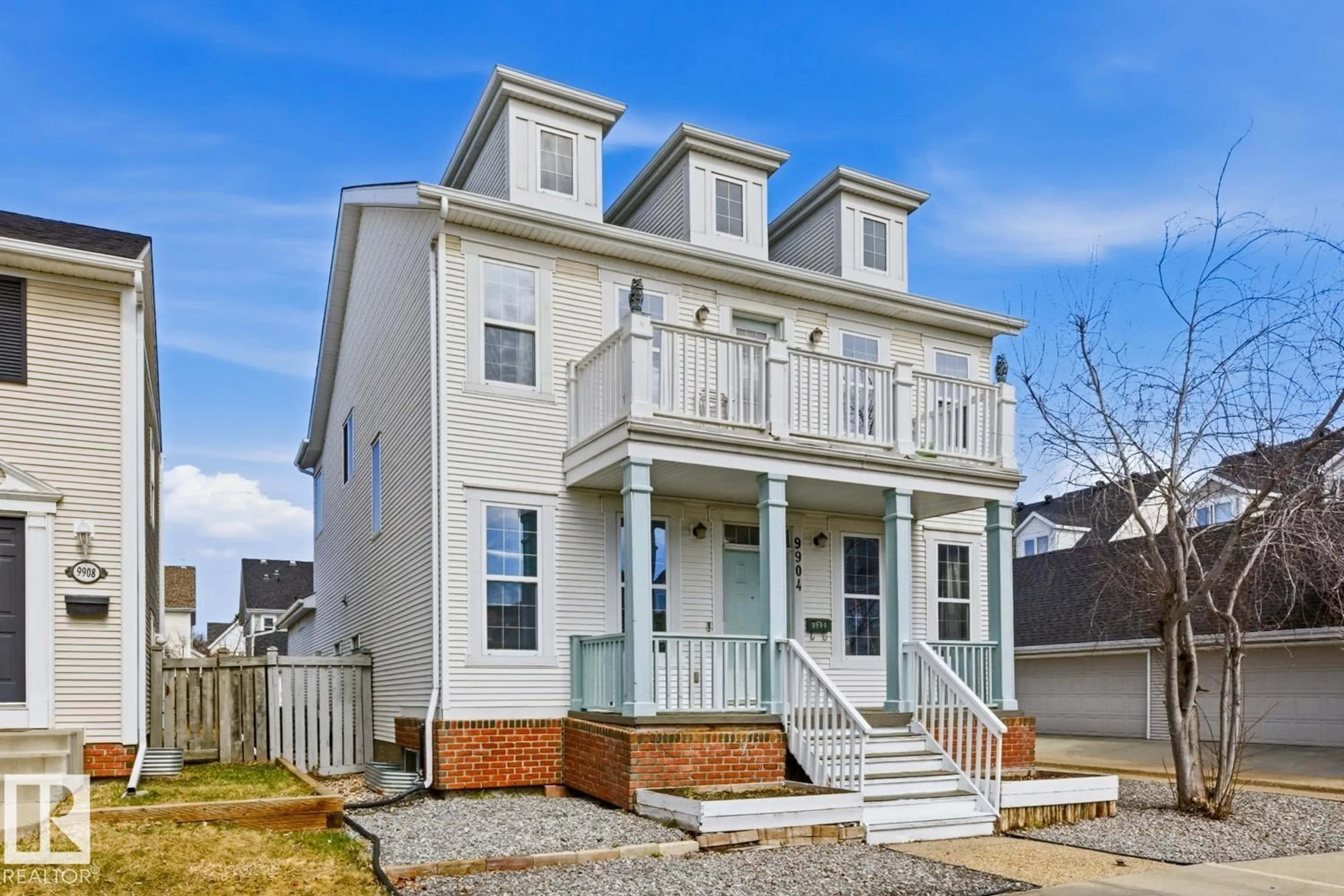 Home with vinyl exterior material, street for 9904 144 AV, Edmonton Alberta T5E6M5