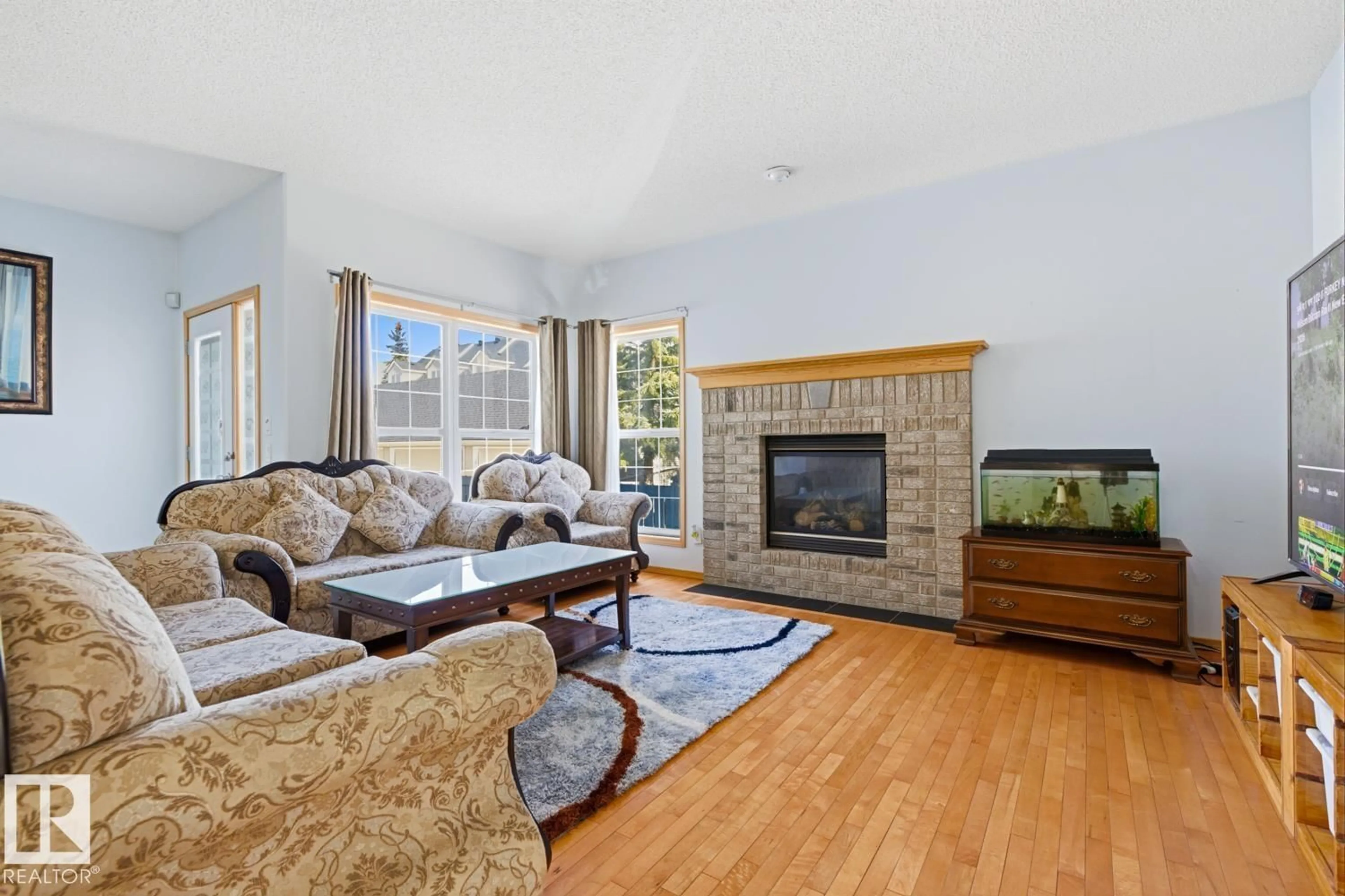 Living room with furniture, unknown for 9904 144 AV, Edmonton Alberta T5E6M5