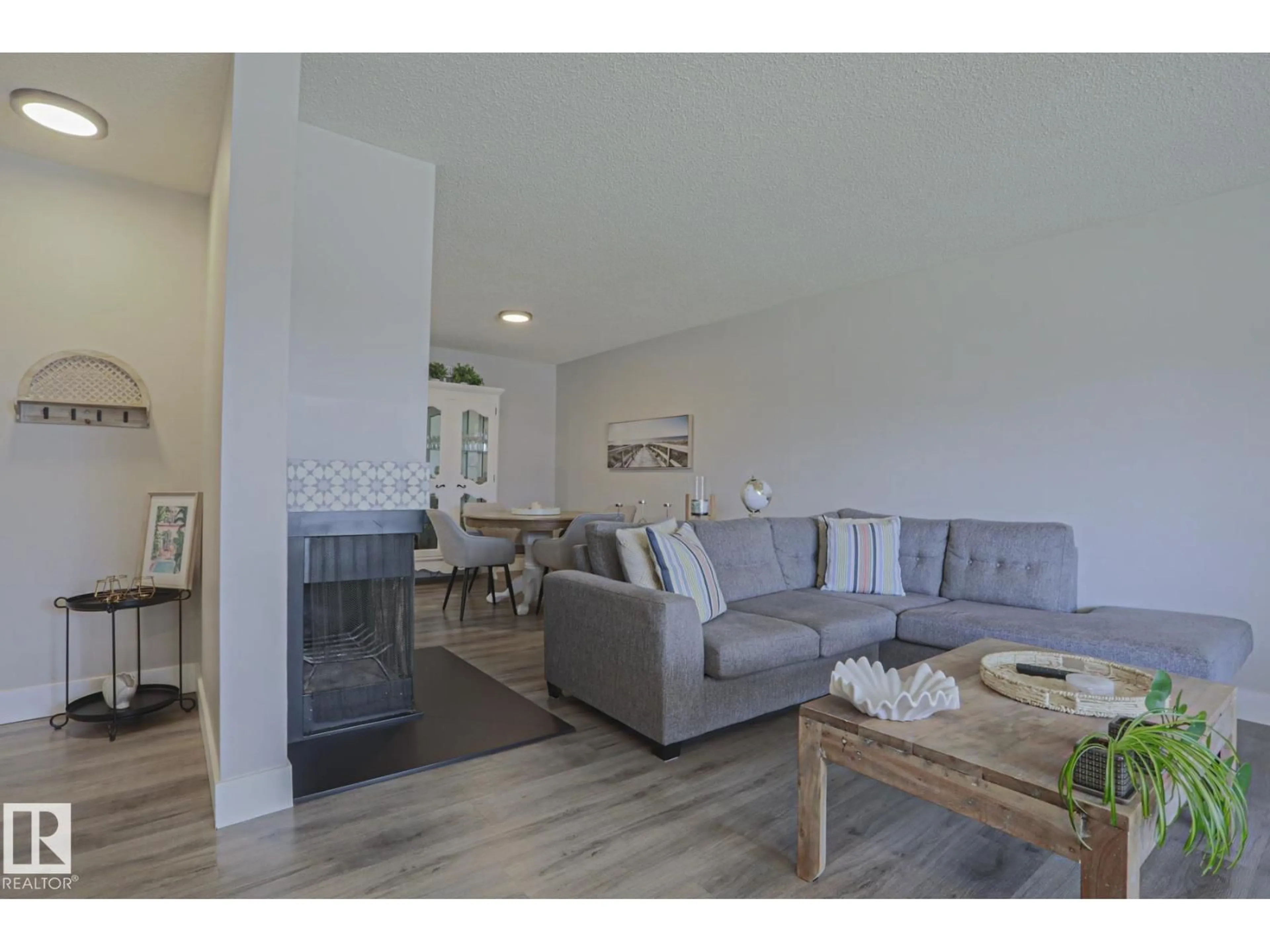 Living room with furniture, wood/laminate floor for #7 - 2204 118 ST, Edmonton Alberta T6J4H1