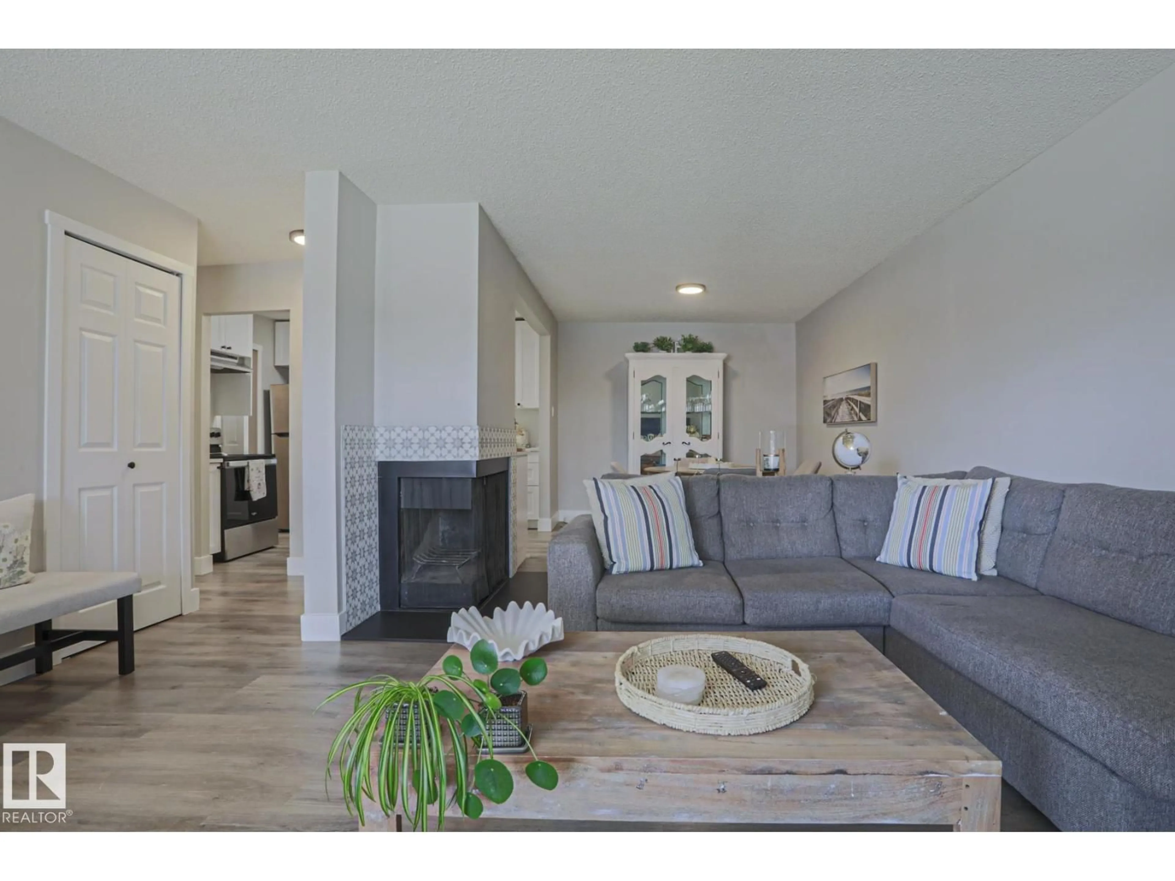 Living room with furniture, wood/laminate floor for #7 - 2204 118 ST, Edmonton Alberta T6J4H1