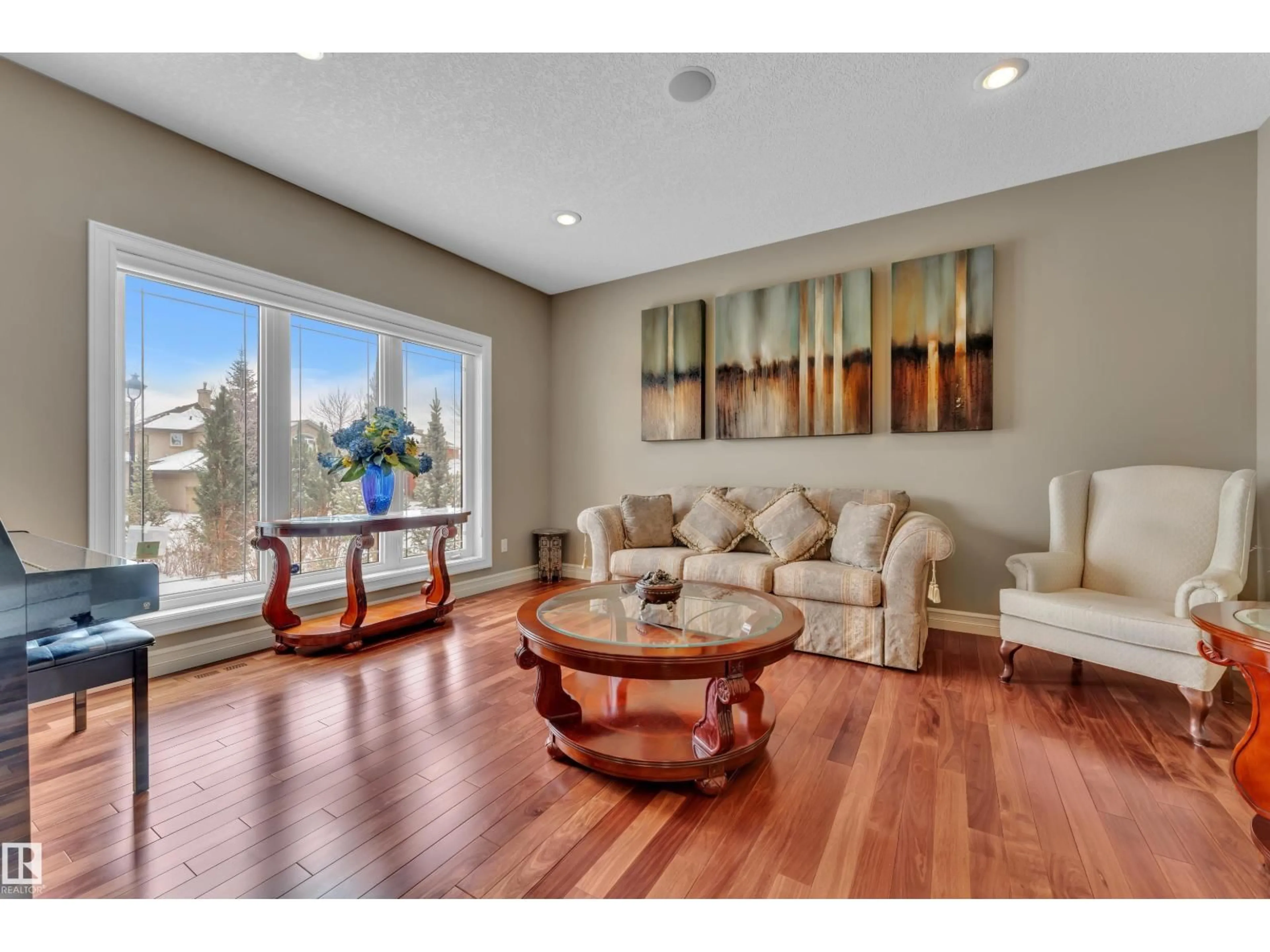 Living room with furniture, wood/laminate floor for 1181 HOLLANDS WY, Edmonton Alberta T6R3S9