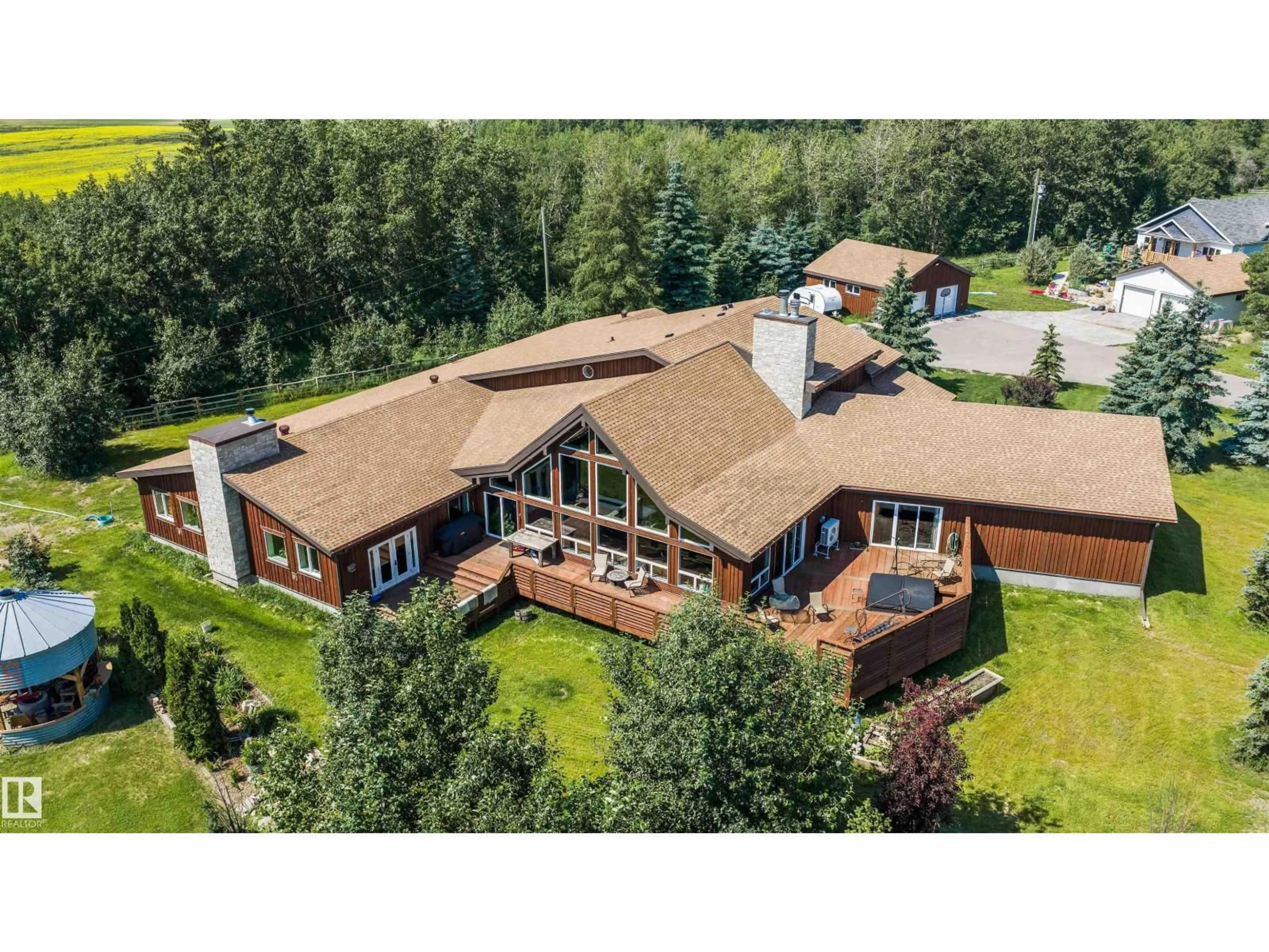 A pic from outside/outdoor area/front of a property/back of a property/a pic from drone, unknown for 55310 HWY 28 A, Rural Sturgeon County Alberta T8L5A4