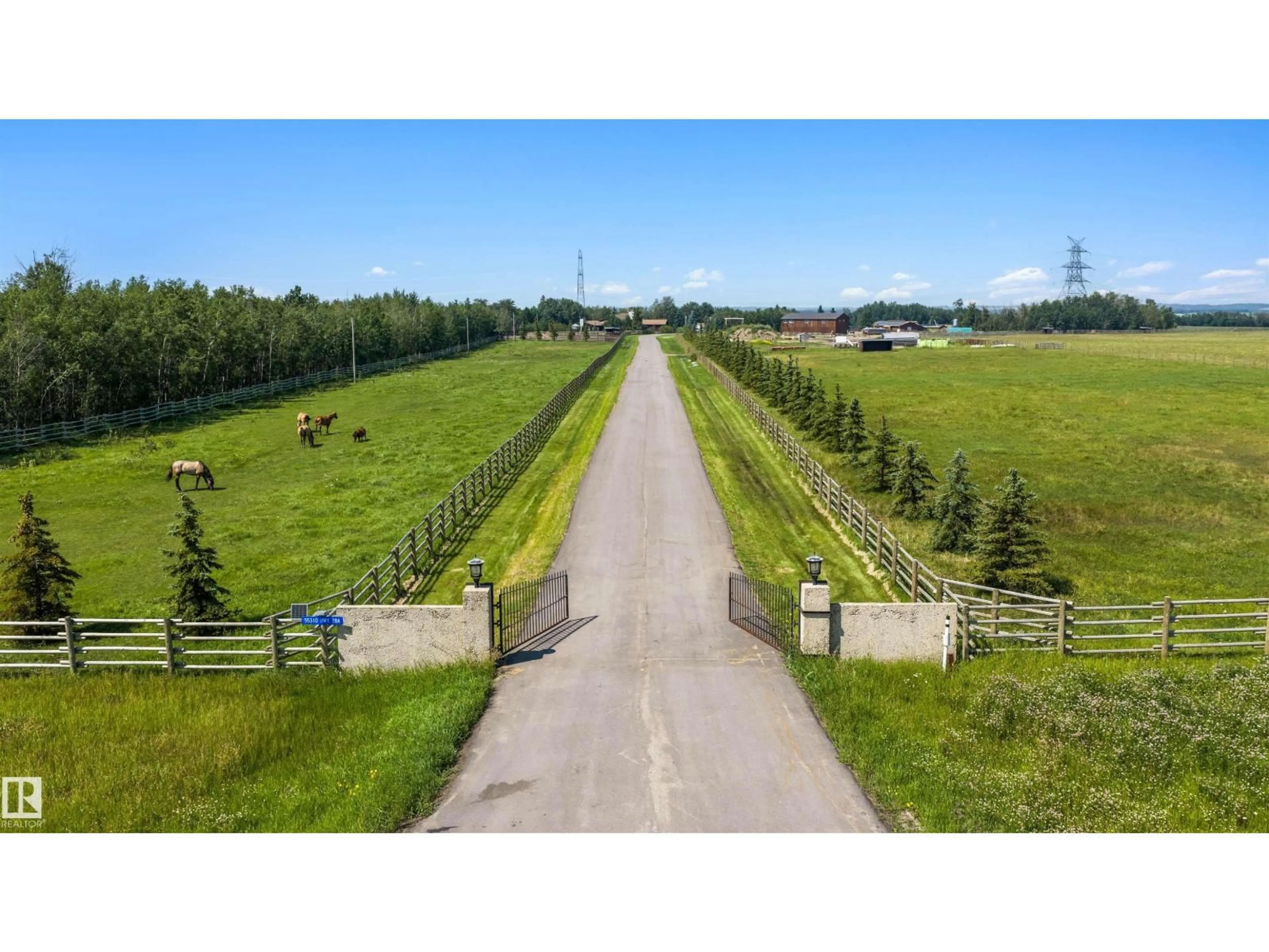 A pic from outside/outdoor area/front of a property/back of a property/a pic from drone, unknown for 55310 HWY 28 A, Rural Sturgeon County Alberta T8L5A4
