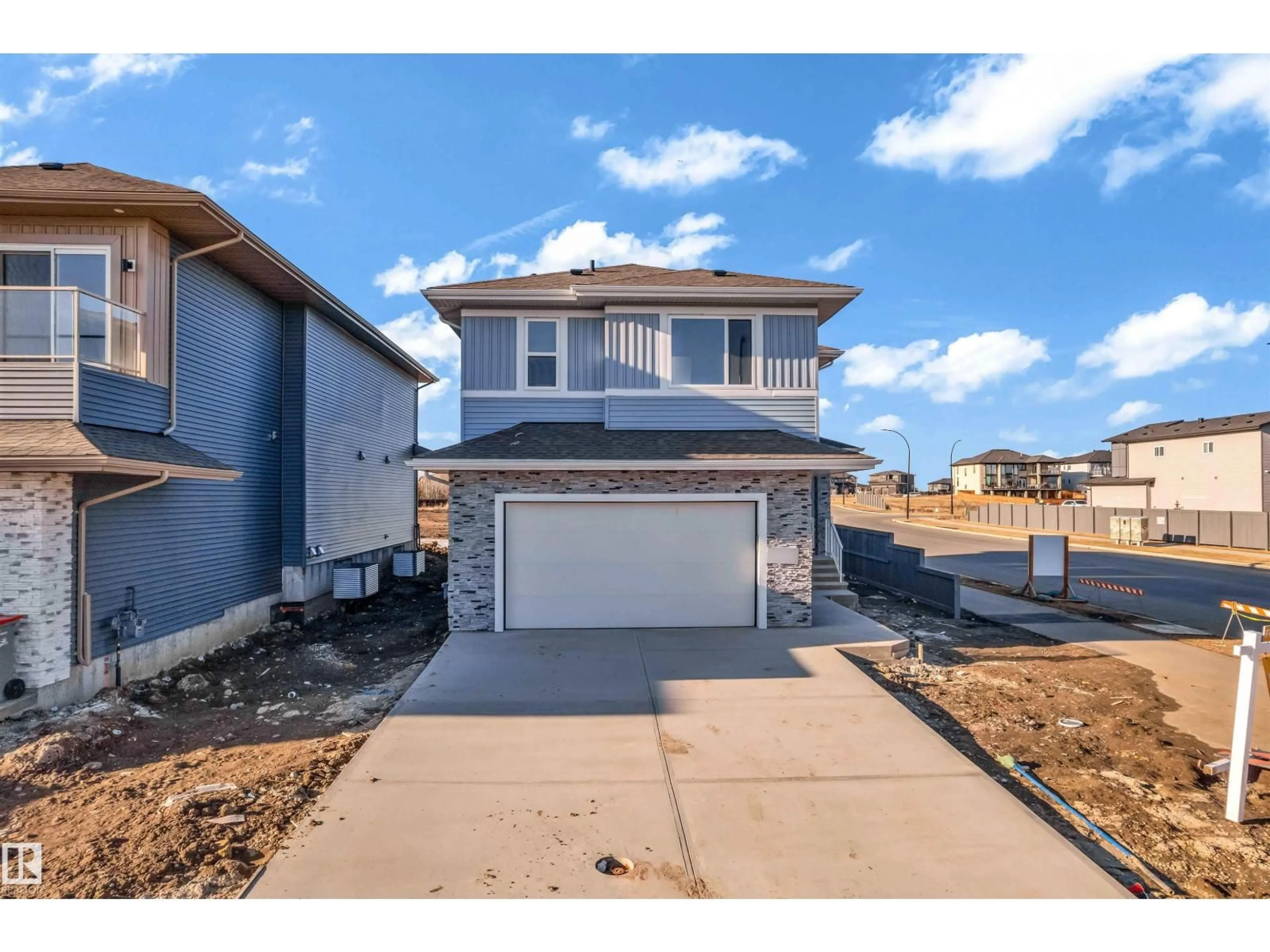 Home with vinyl exterior material, street for NE - 2420 63 AV, Rural Leduc County Alberta T4X3A6