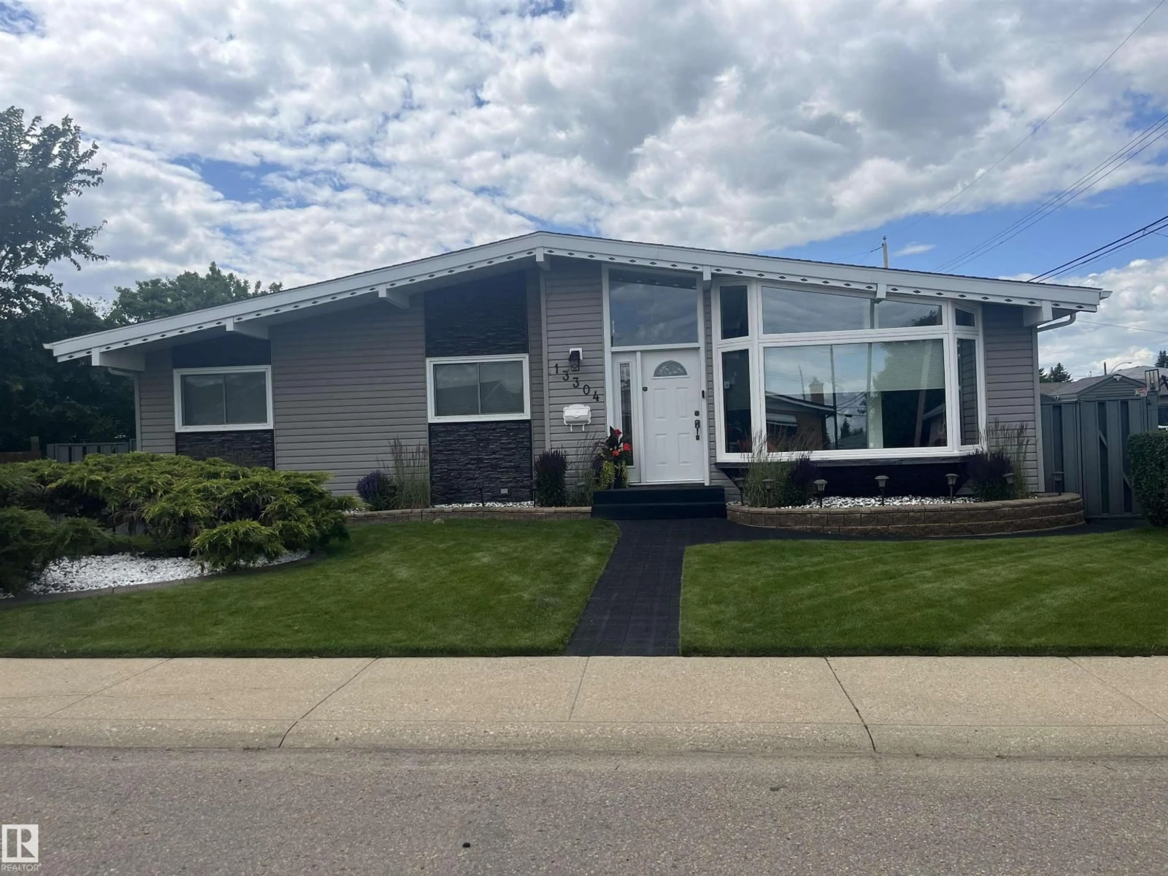 Home with vinyl exterior material, street for NW - 13304 70 ST, Edmonton Alberta T5C0K3
