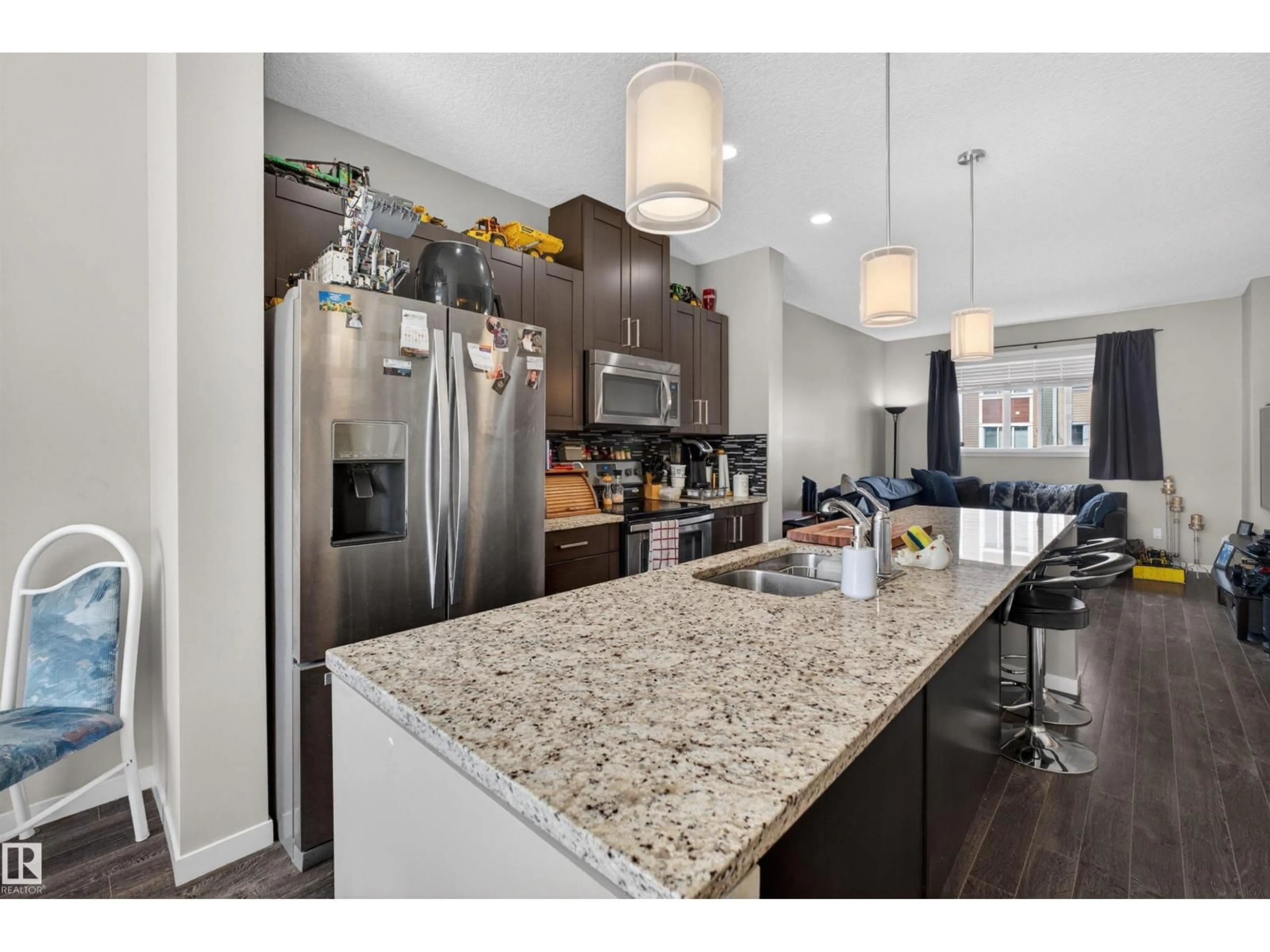Open concept kitchen, ceramic/tile floor for 9 - 320 SECORD BV, Edmonton Alberta T5T7E8