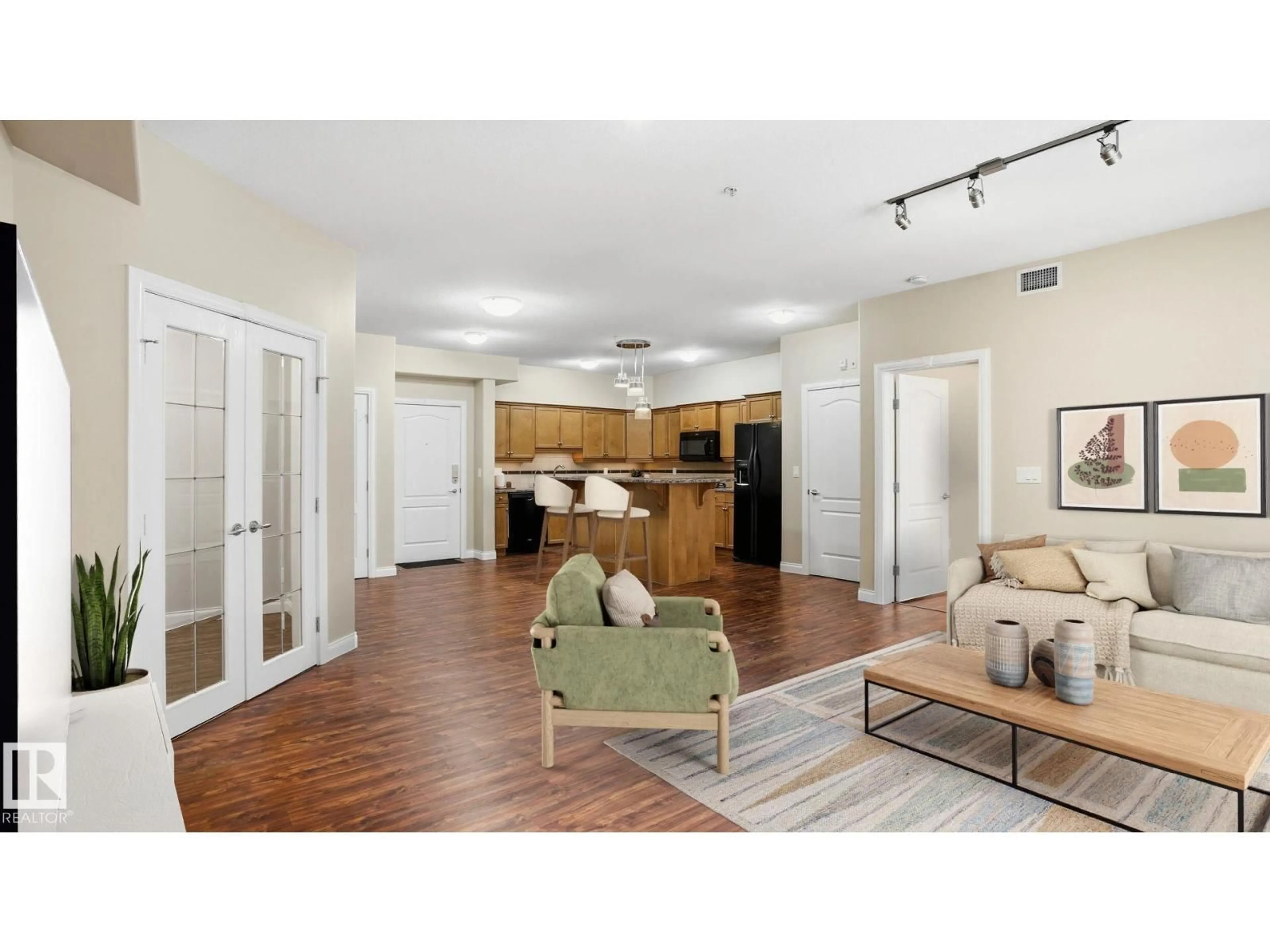 Living room with furniture, wood/laminate floor for #138 - 1406 HODGSON WY, Edmonton Alberta T6R3K1