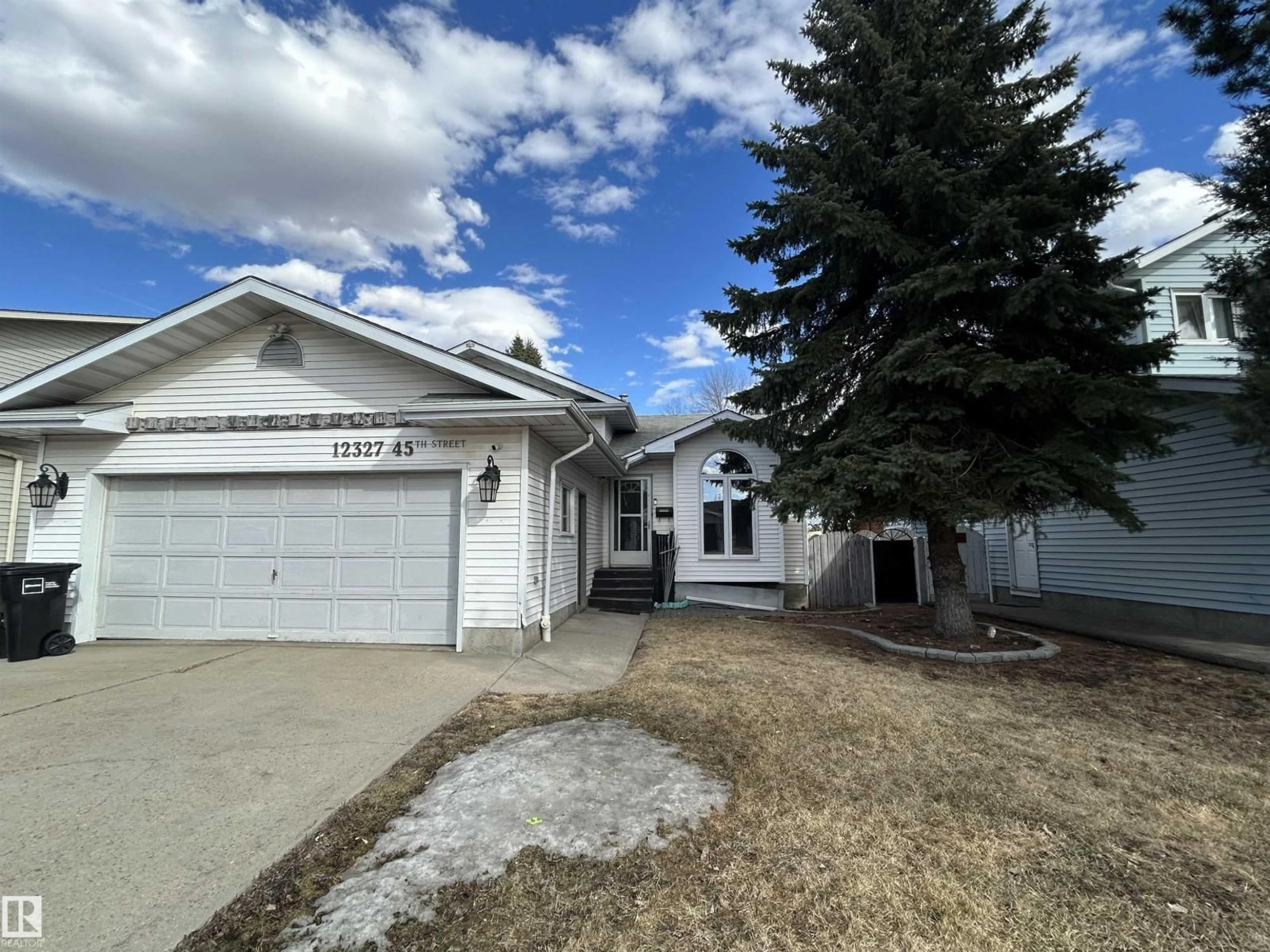 Home with vinyl exterior material, street for NW - 12327 45 ST, Edmonton Alberta T5W5C3