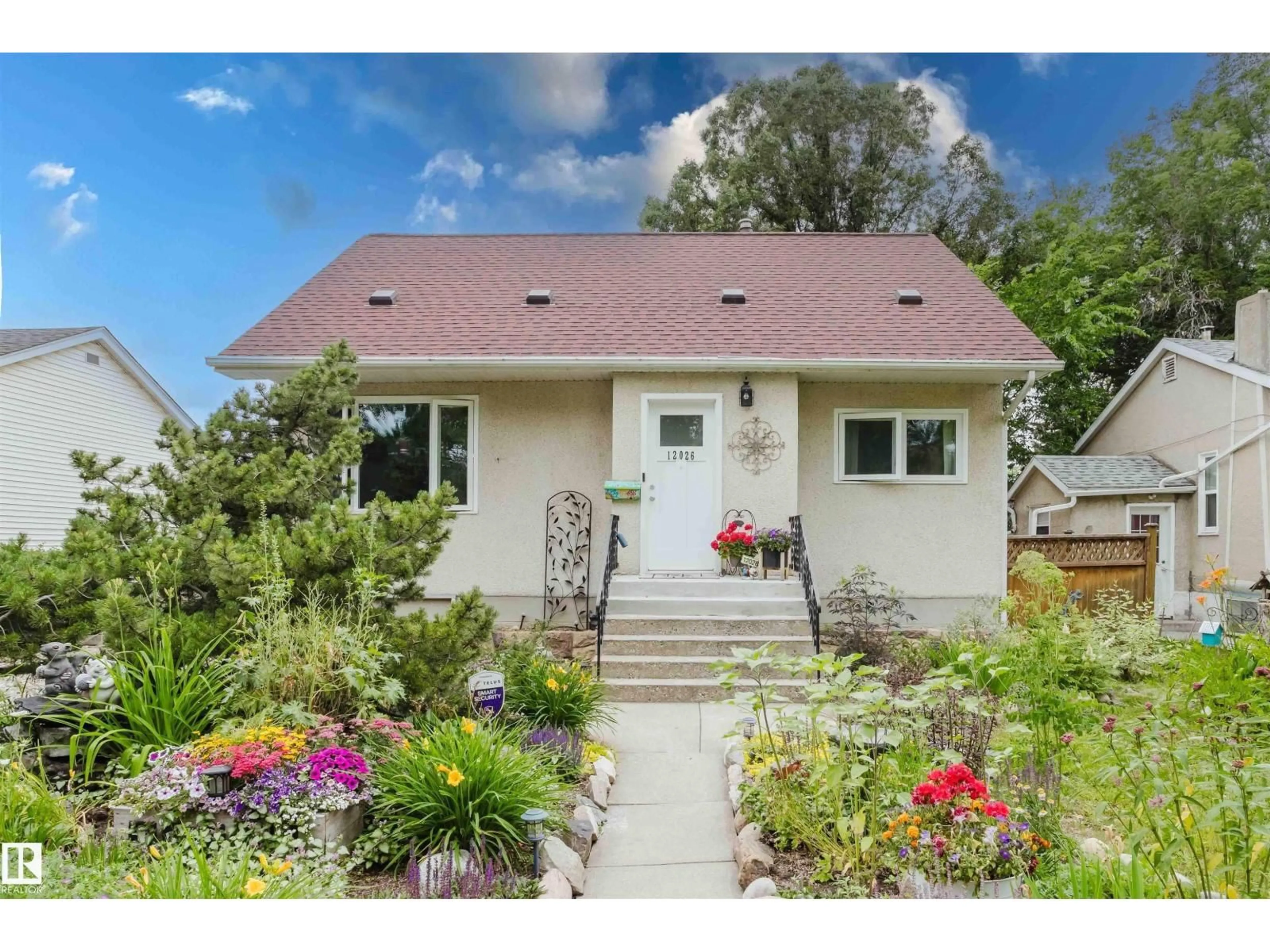 Home with vinyl exterior material, street for 12026 104 ST, Edmonton Alberta T5G2L4