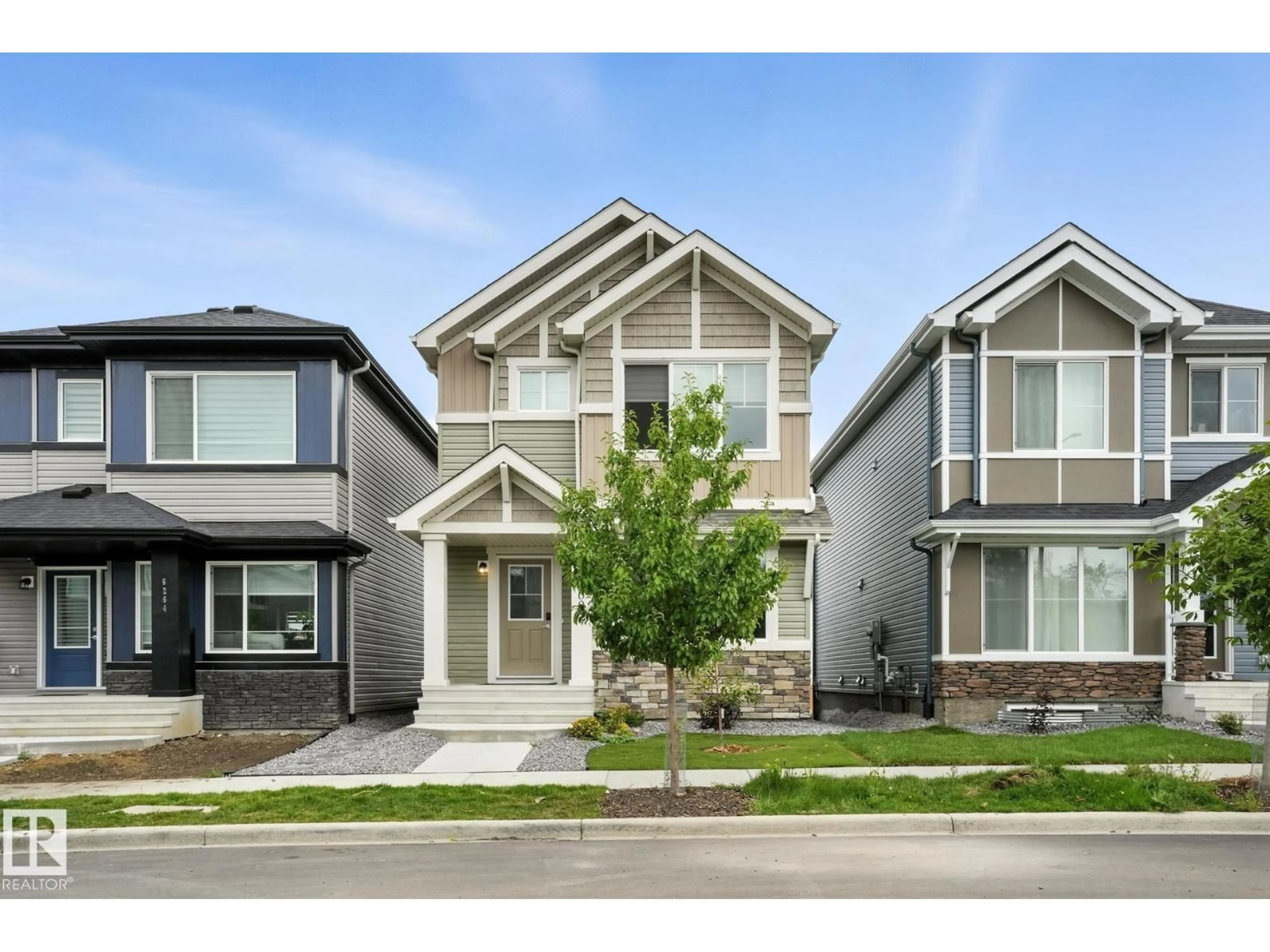 Home with vinyl exterior material, street for 6260 175 AV, Edmonton Alberta T5Y4H3