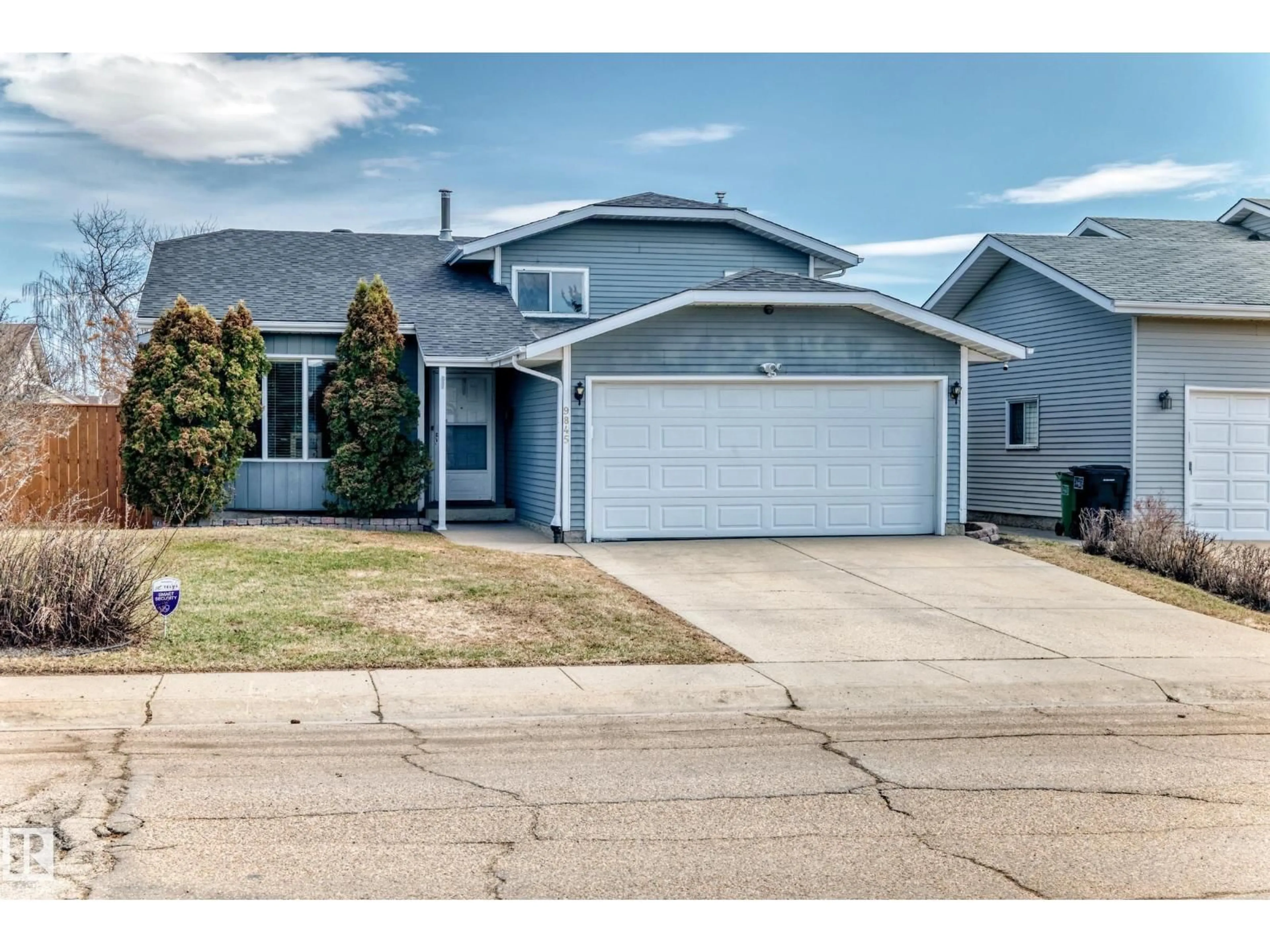 Home with vinyl exterior material, street for 9845 184 ST, Edmonton Alberta T5T4L5