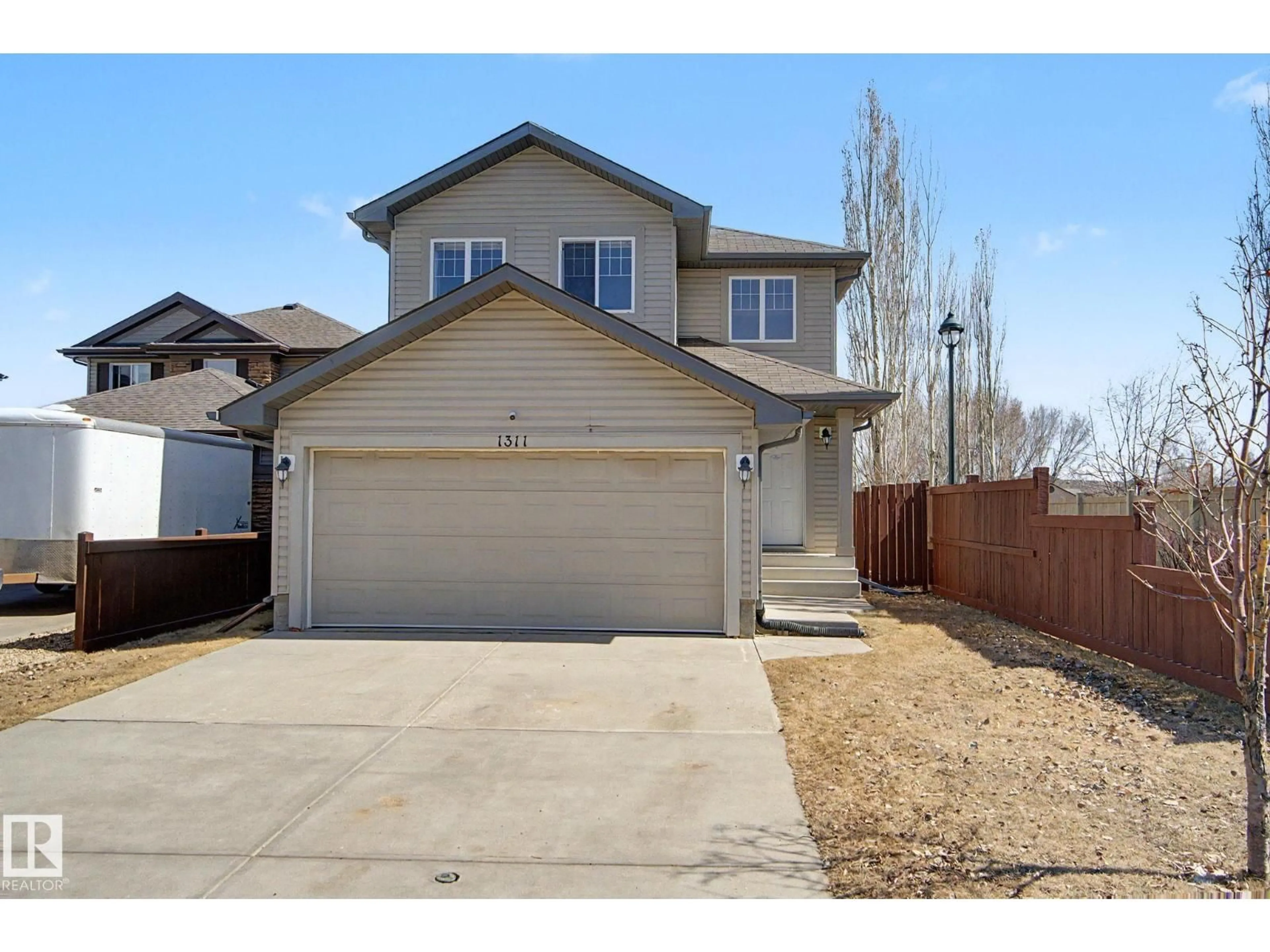 Home with vinyl exterior material, street for SW - 1311 117 ST, Edmonton Alberta T6W0E6
