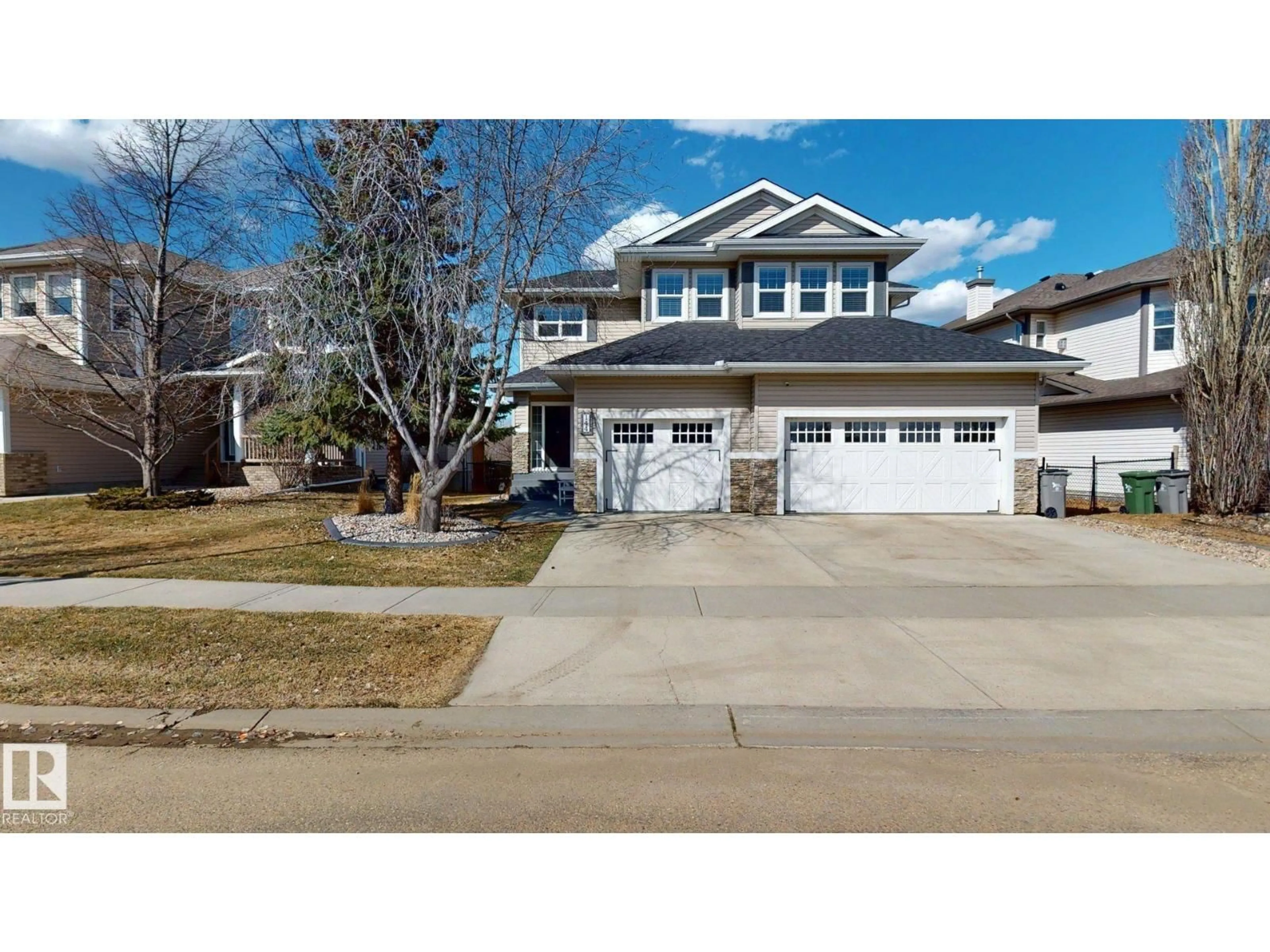 Home with vinyl exterior material, street for 144 REICHERT DR, Beaumont Alberta T4X1S3