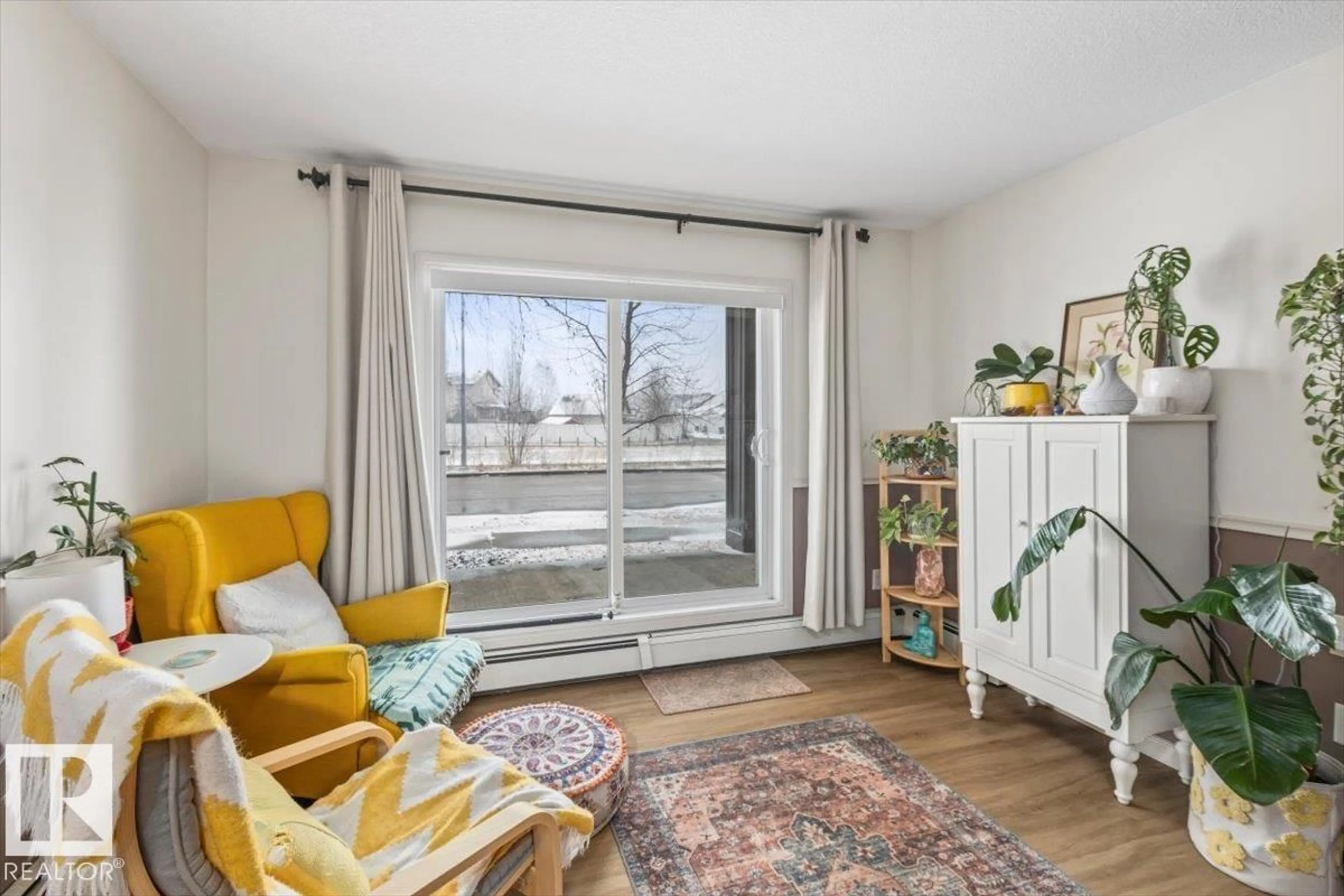 Living room with furniture, wood/laminate floor for #106 - 1204 156 ST, Edmonton Alberta T6R0R6