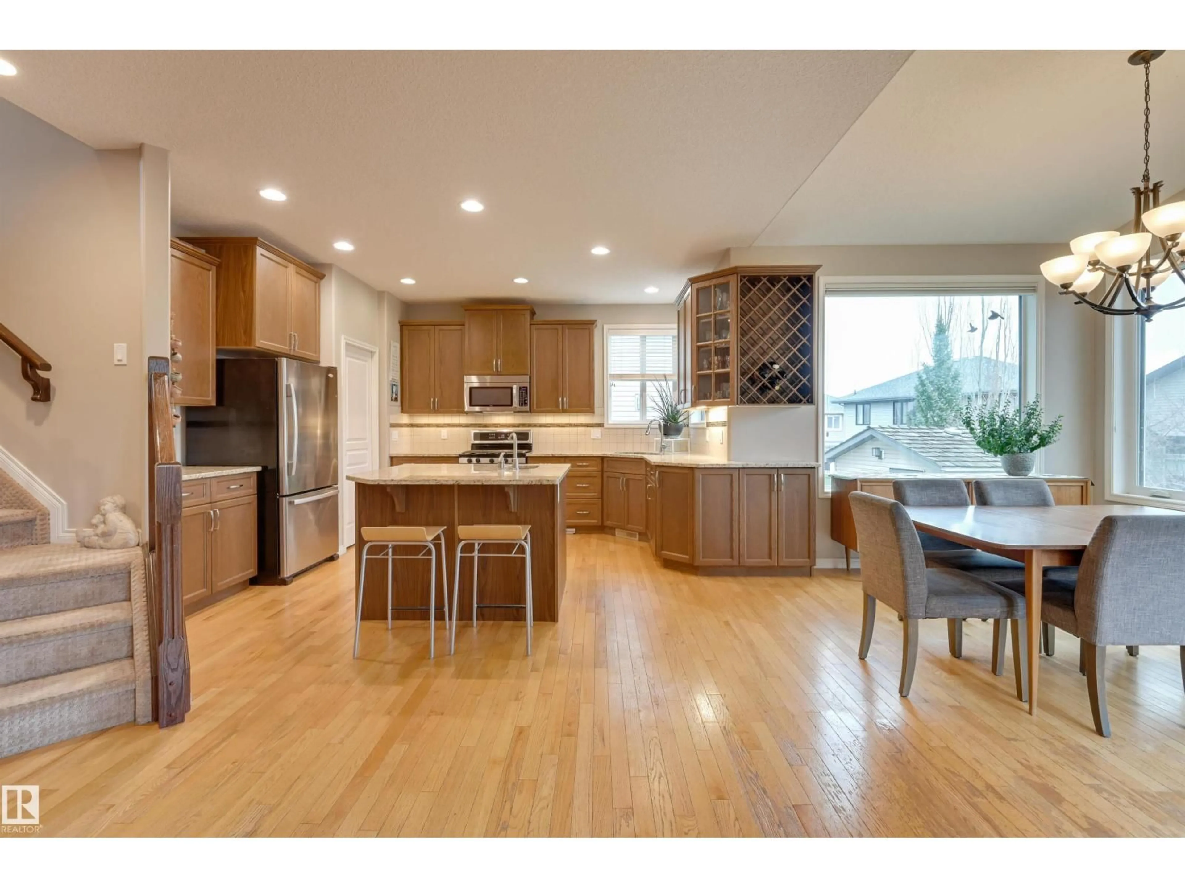 Open concept kitchen, wood/laminate floor for 20645 93A AV, Edmonton Alberta T5T4B5