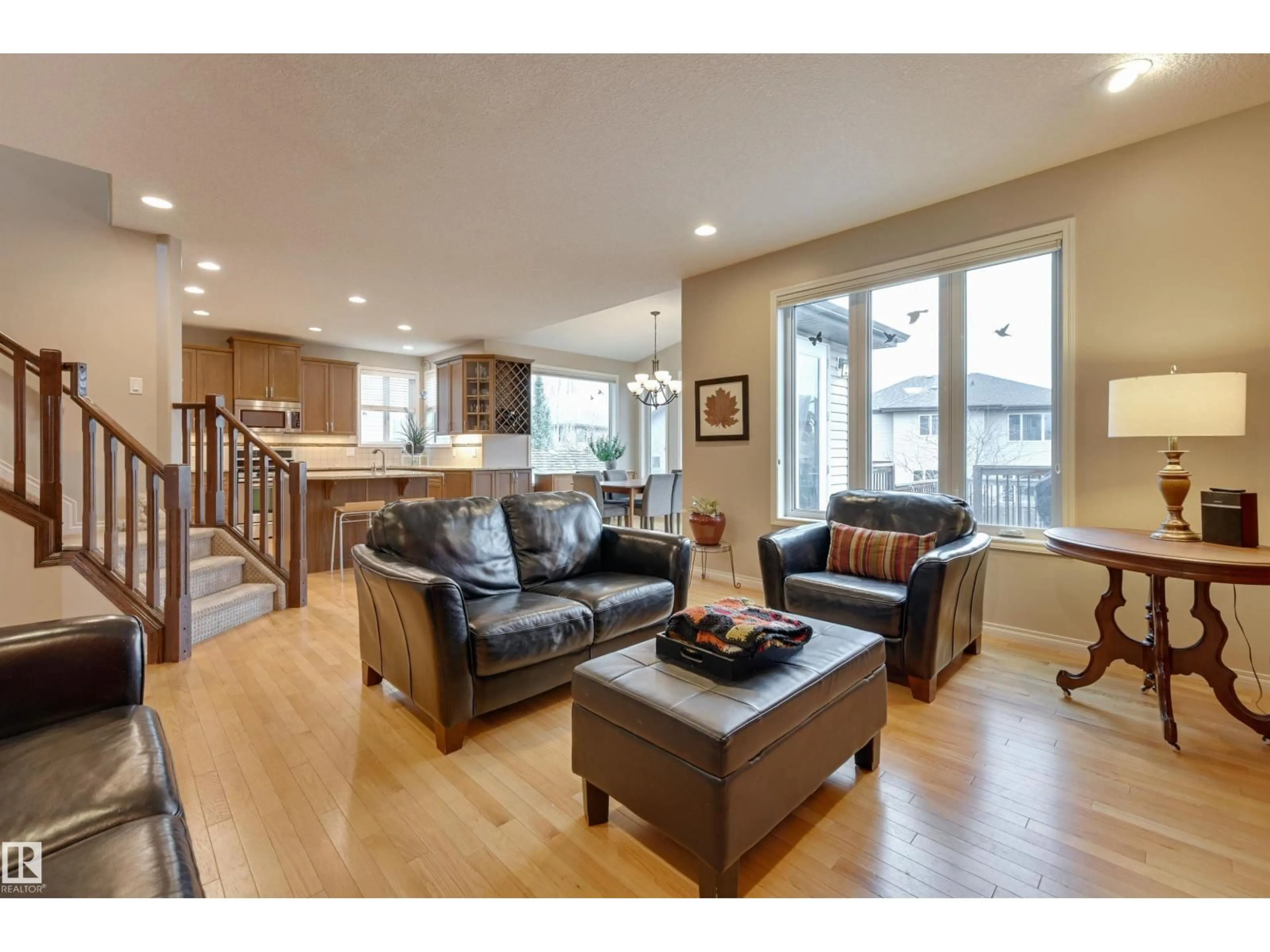 Living room with furniture, wood/laminate floor for 20645 93A AV, Edmonton Alberta T5T4B5