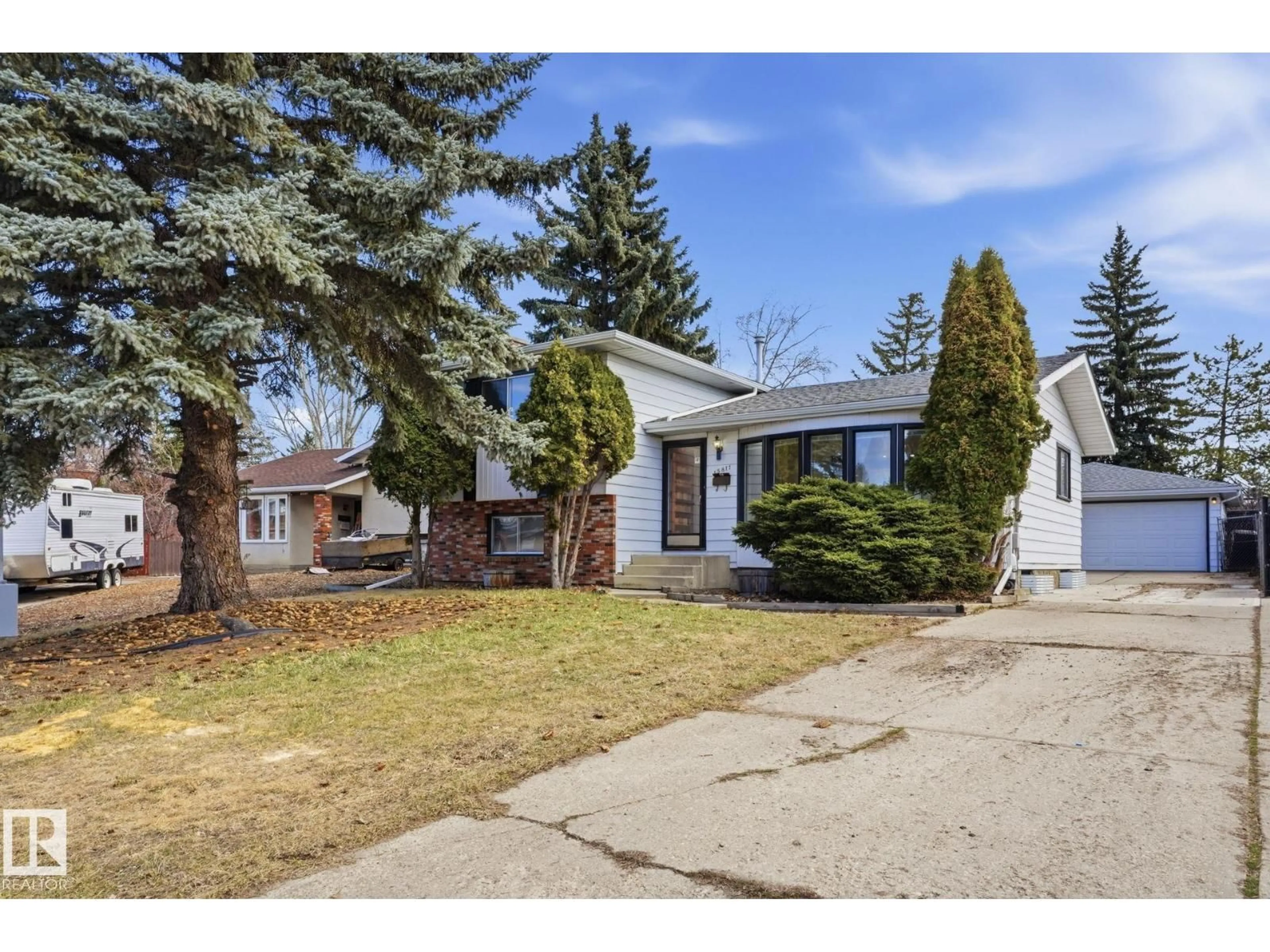 Home with vinyl exterior material, street for 15811 114 ST NW, Edmonton Alberta T5X2V2