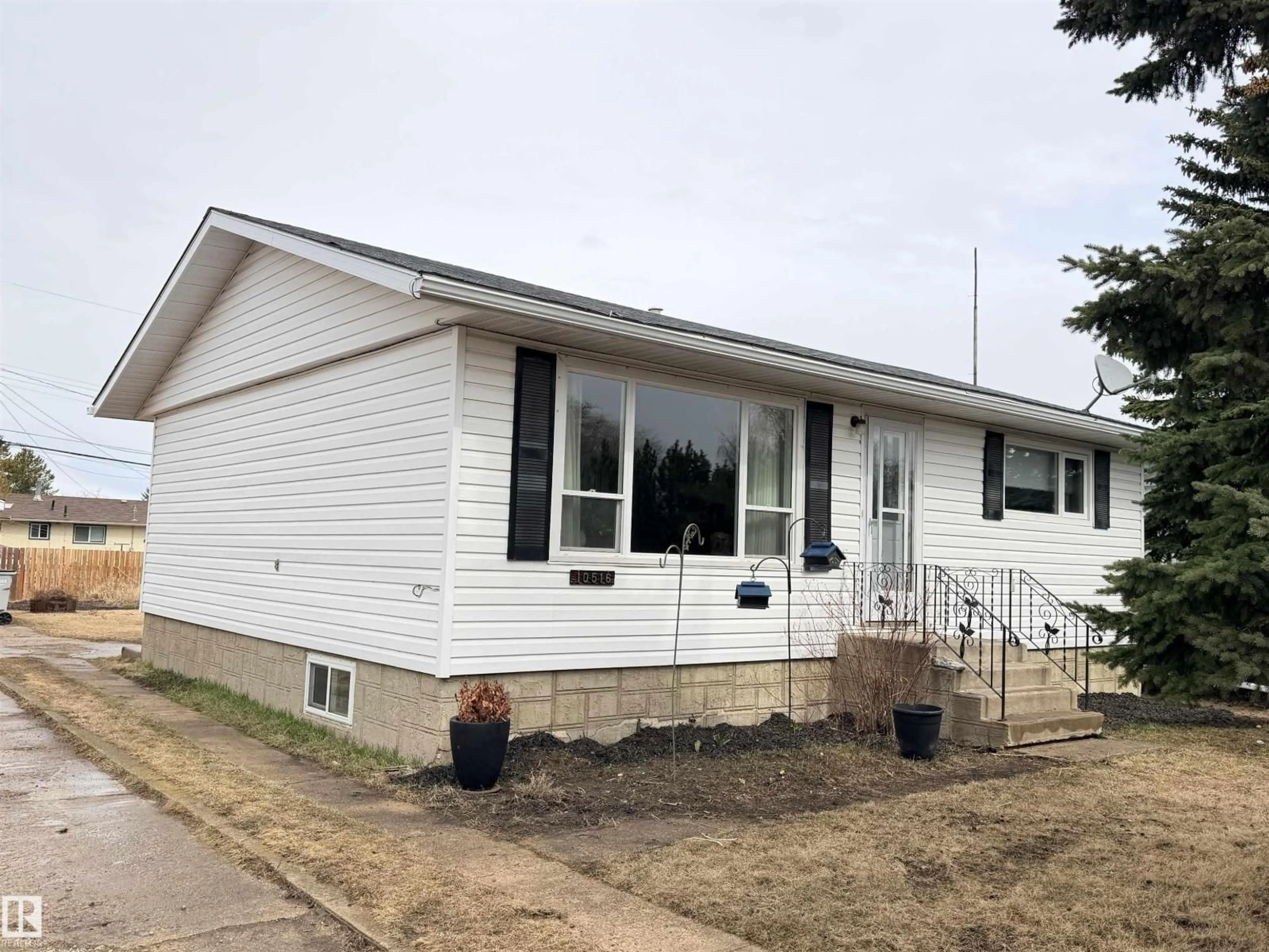 Home with vinyl exterior material, street for 10516 104 ST, Westlock Alberta T7P1M1
