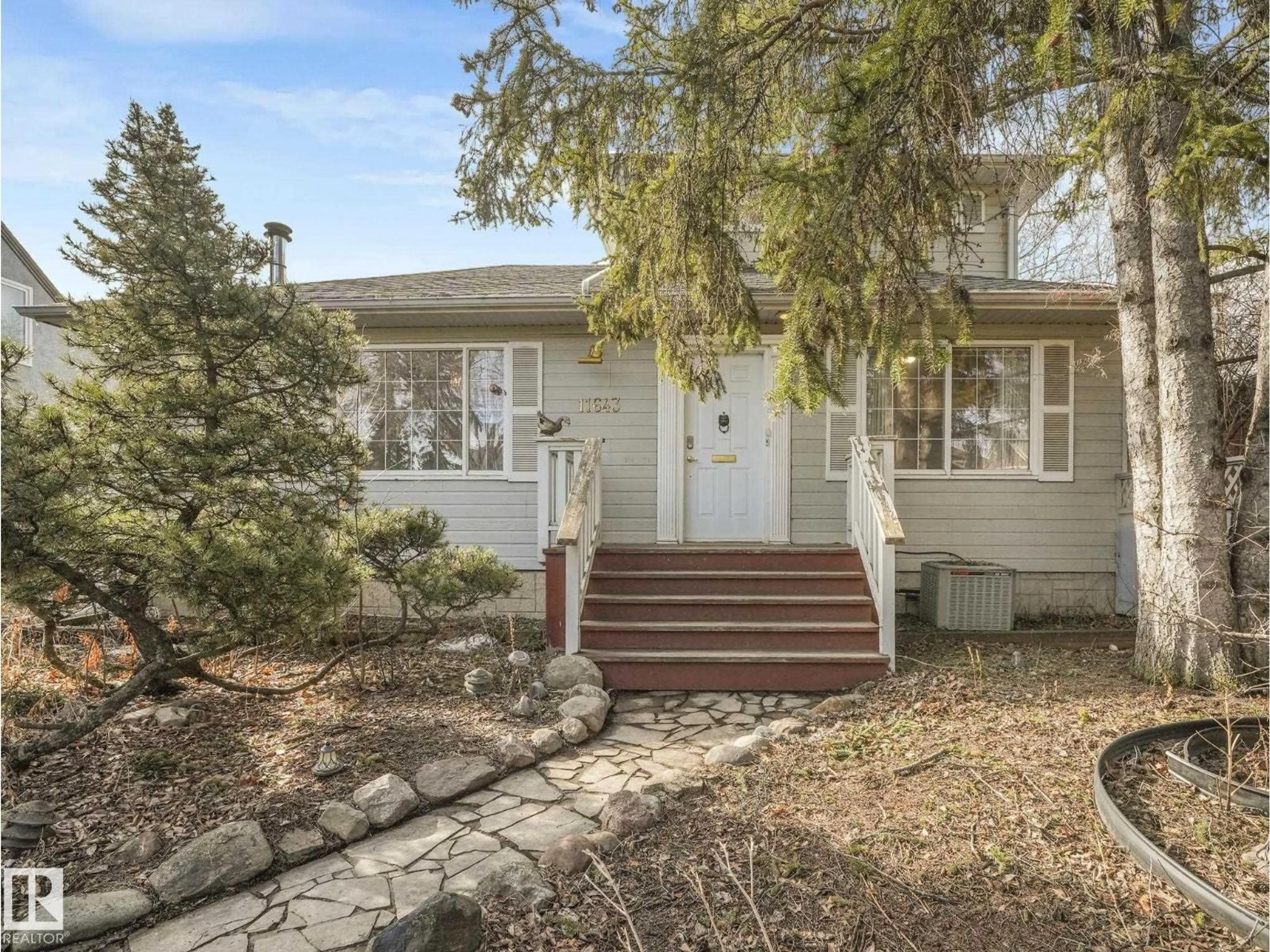 Home with vinyl exterior material, street for 11643 76 AV, Edmonton Alberta T6G0K9