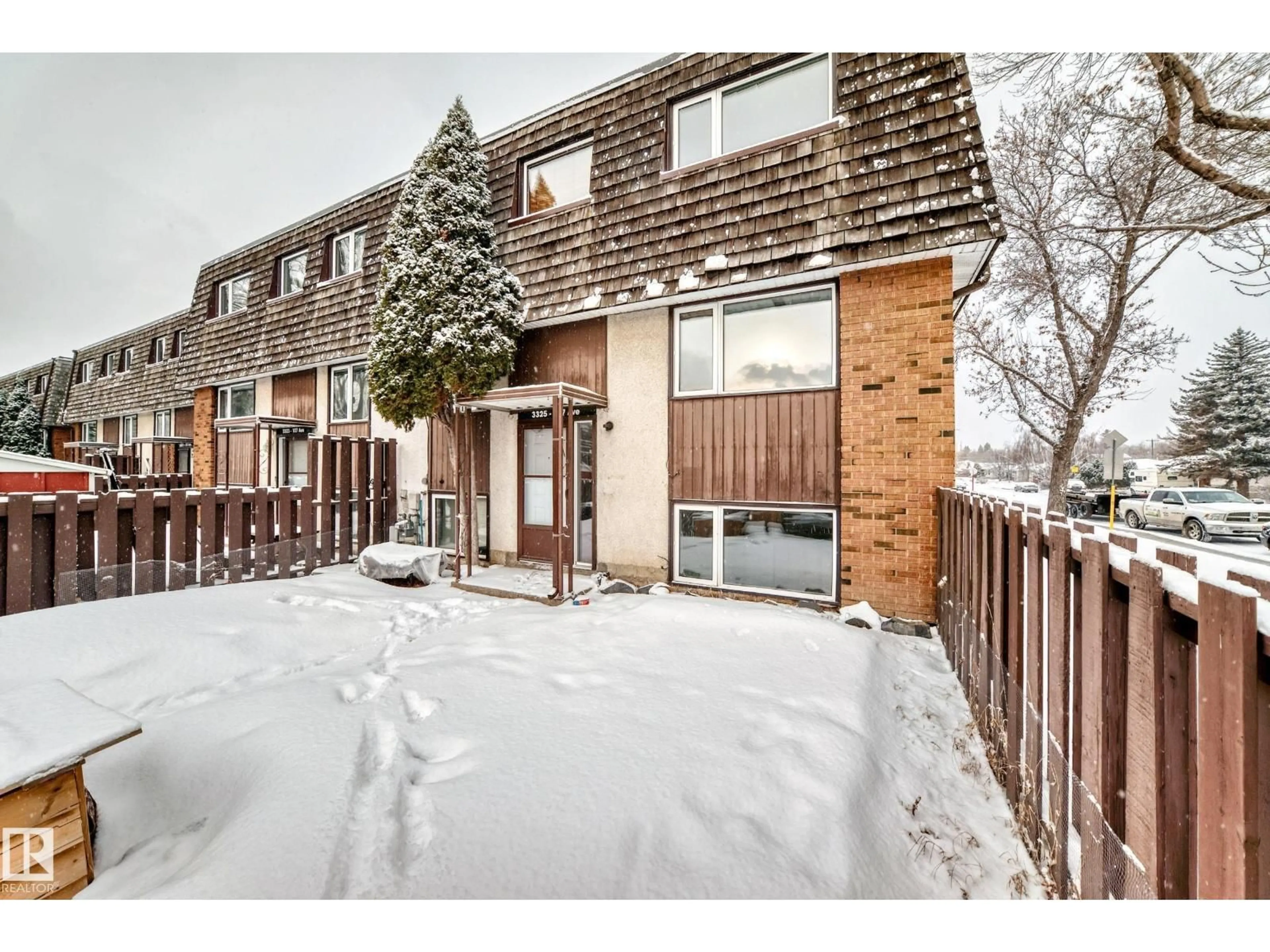 A pic from outside/outdoor area/front of a property/back of a property/a pic from drone, street for 3325 107 AV NW, Edmonton Alberta T5W0C6