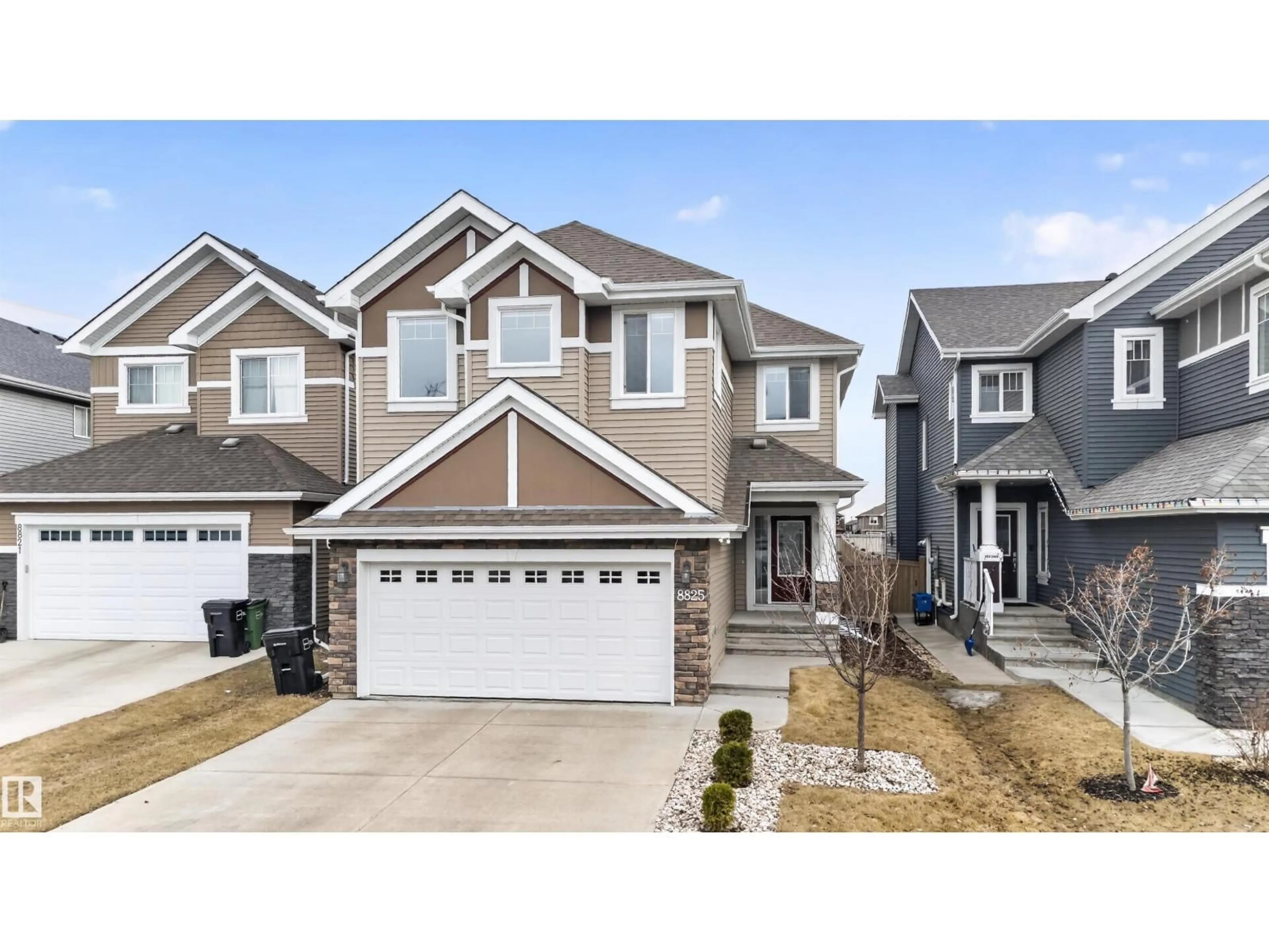 Home with vinyl exterior material, street for 8825 24 AV, Edmonton Alberta T6X2C9