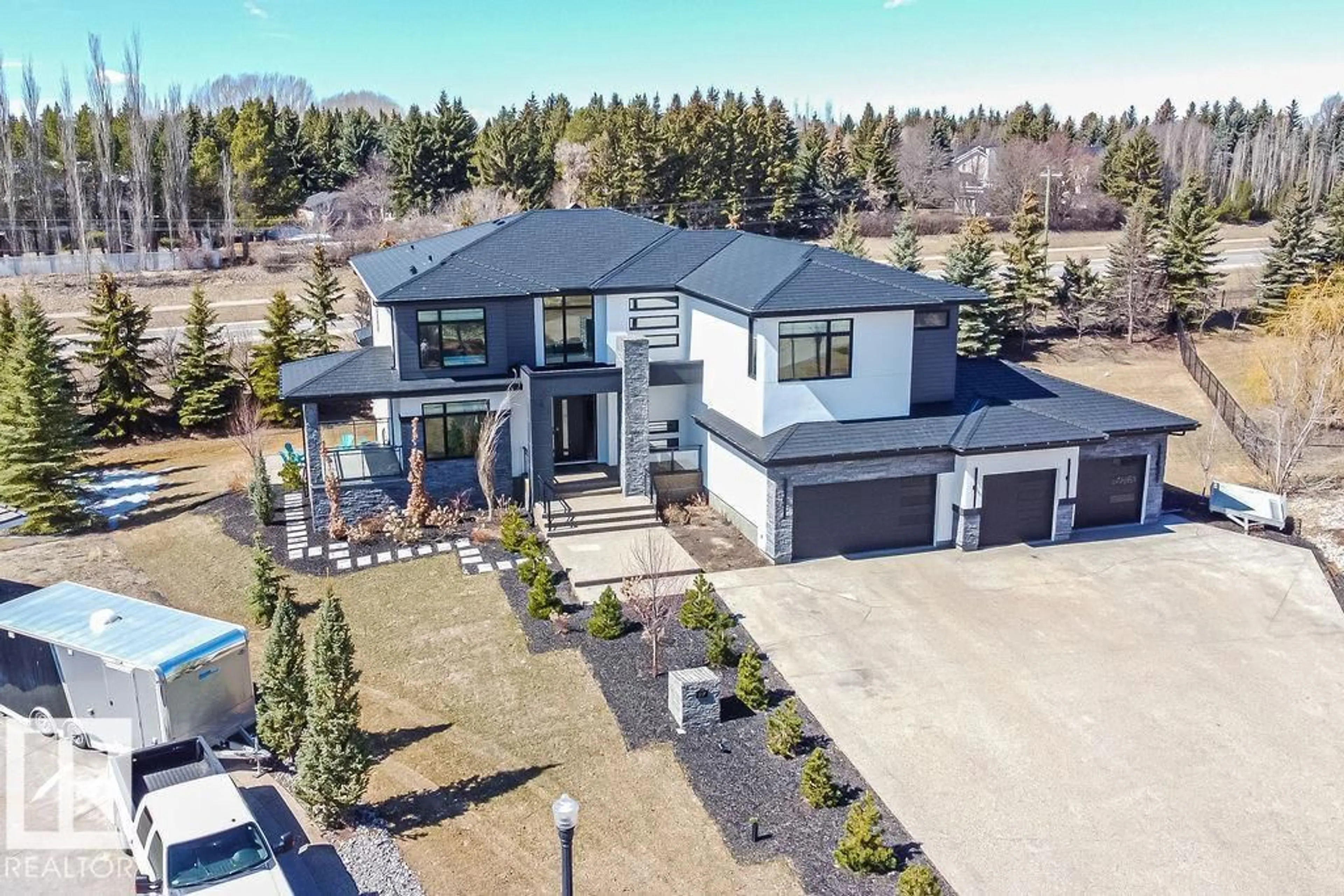 A pic from outside/outdoor area/front of a property/back of a property/a pic from drone, street for 97 PINNACLE TC, Rural Sturgeon County Alberta T8T0B5