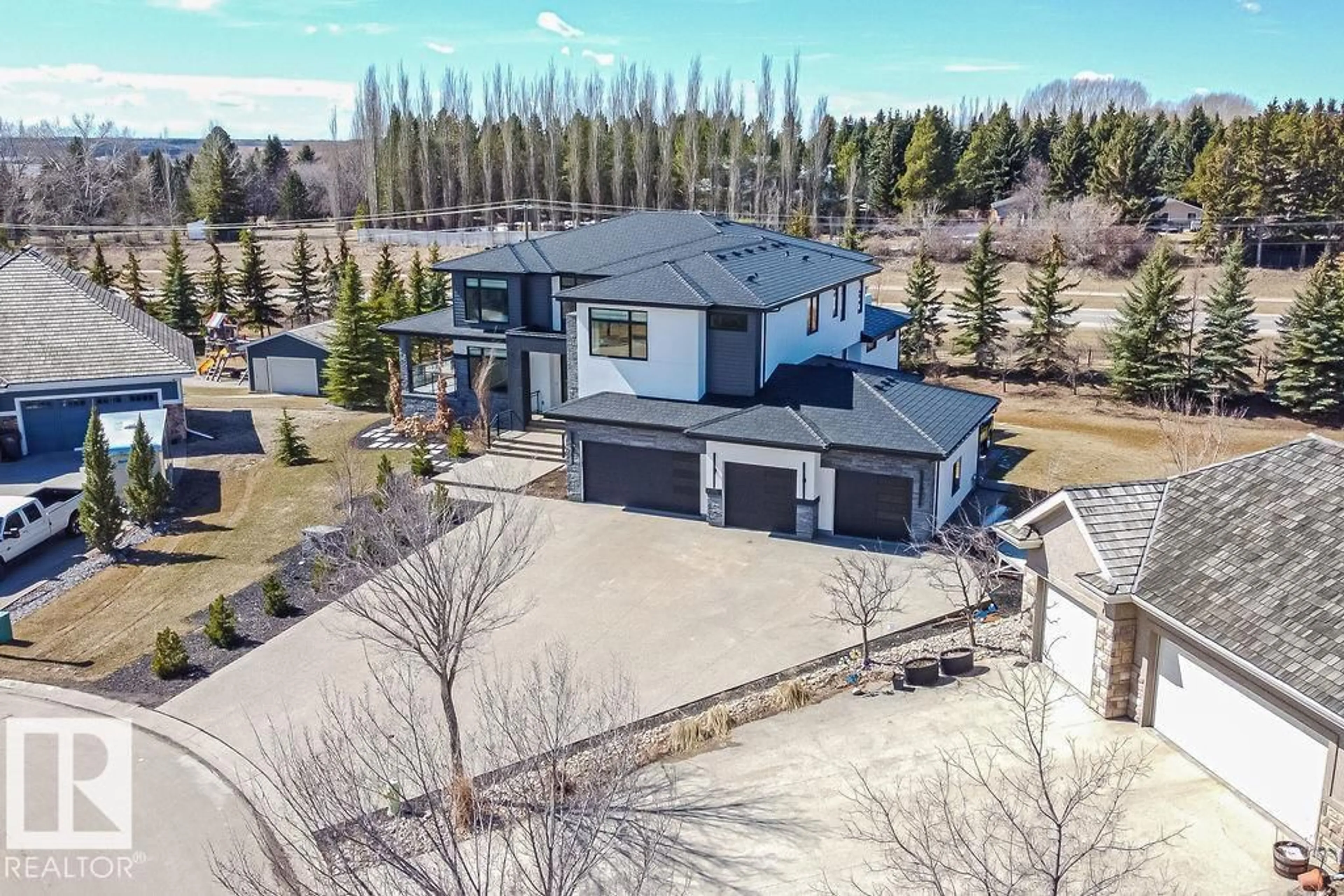 A pic from outside/outdoor area/front of a property/back of a property/a pic from drone, mountain view for 97 PINNACLE TC, Rural Sturgeon County Alberta T8T0B5